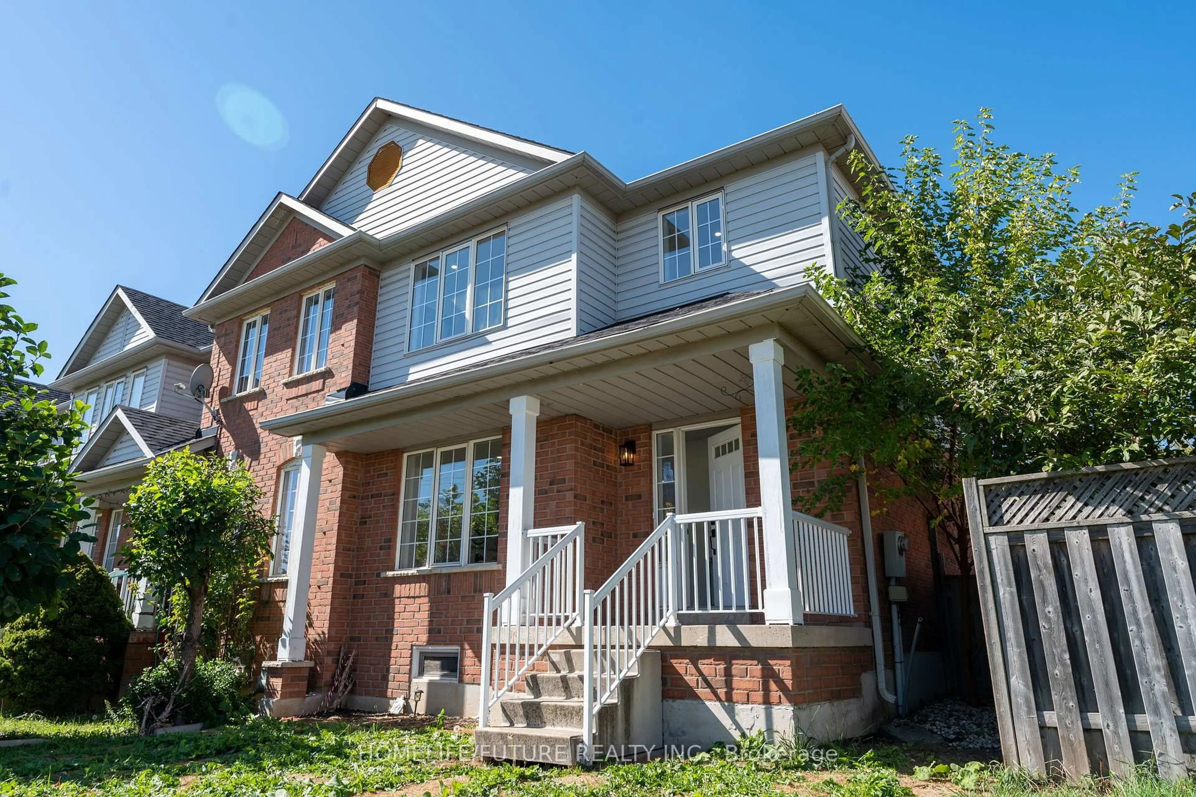 Home with brick exterior material, street for 136 Manley Lane, Milton Ontario L9T 5N9