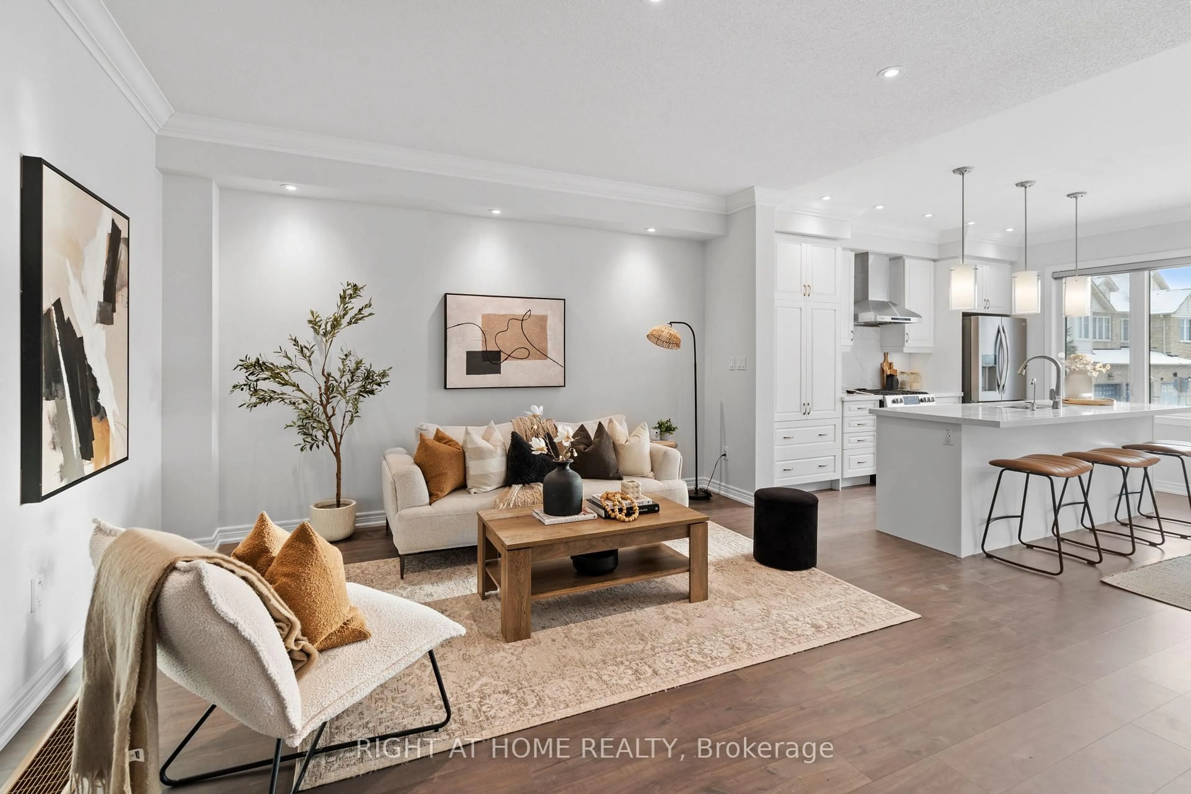 Living room with furniture, wood/laminate floor for 16 Doris Pawley Cres, Caledon Ontario L7C 4E7