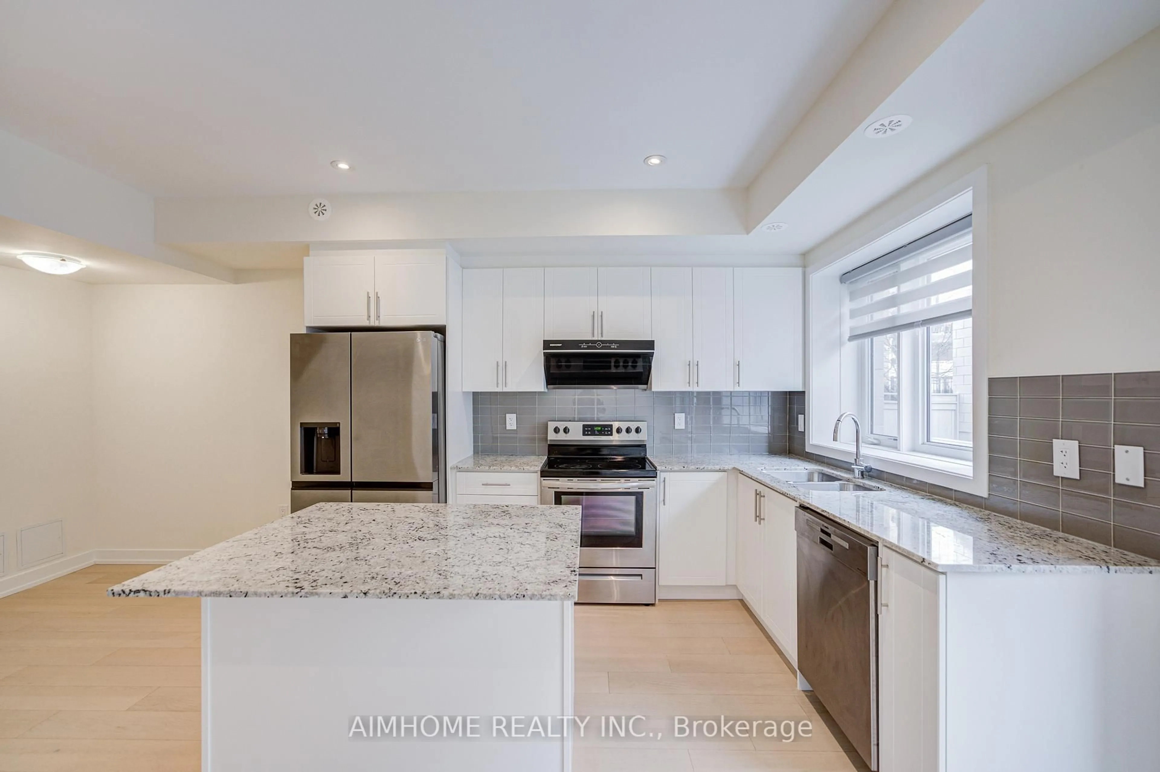 Open concept kitchen, ceramic/tile floor for 135 Frederick Tisdale Dr, Toronto Ontario M3K 0C6