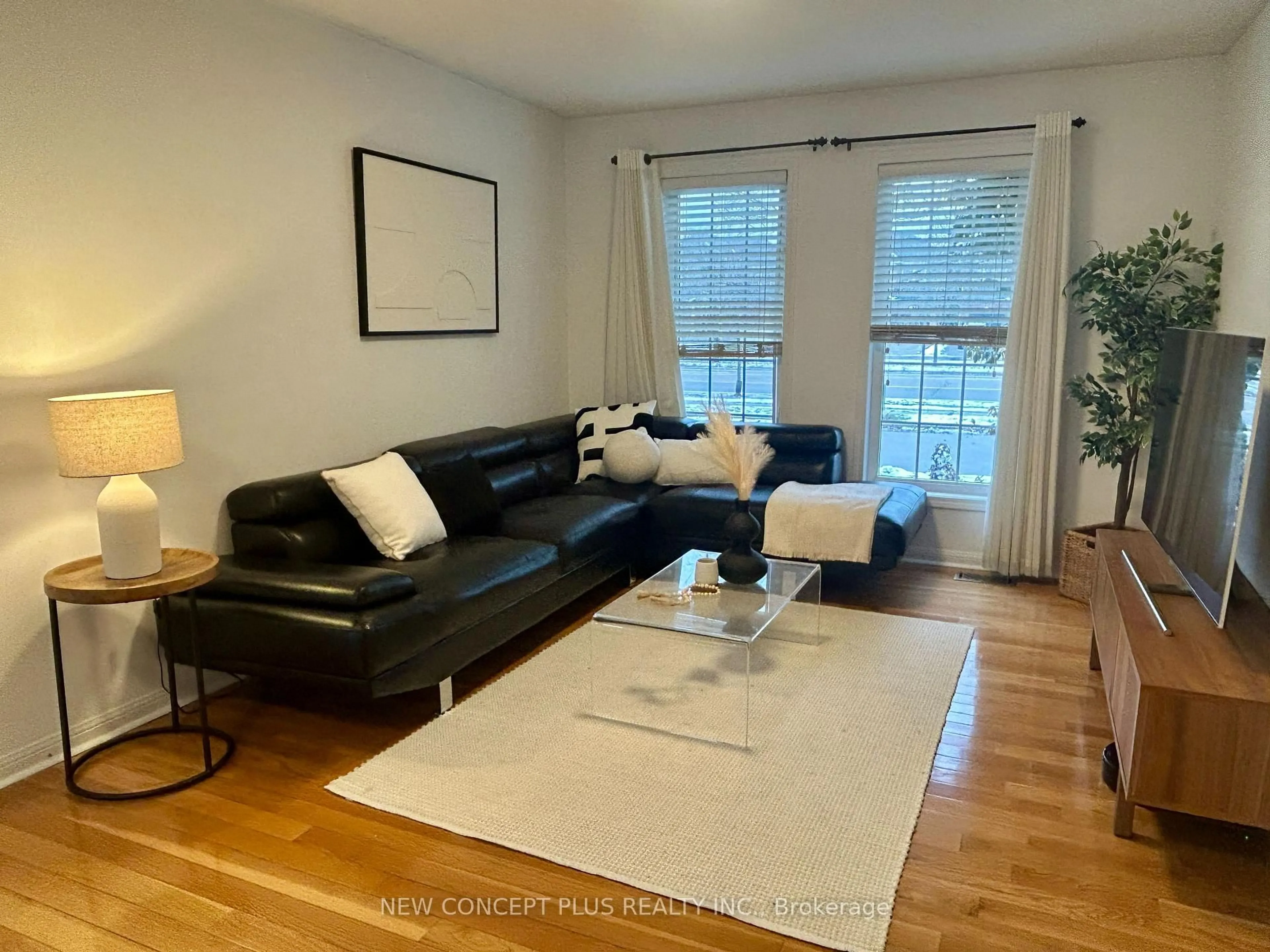 Living room with furniture, wood/laminate floor for 2375 Proudfoot Tr, Oakville Ontario L6M 4X9