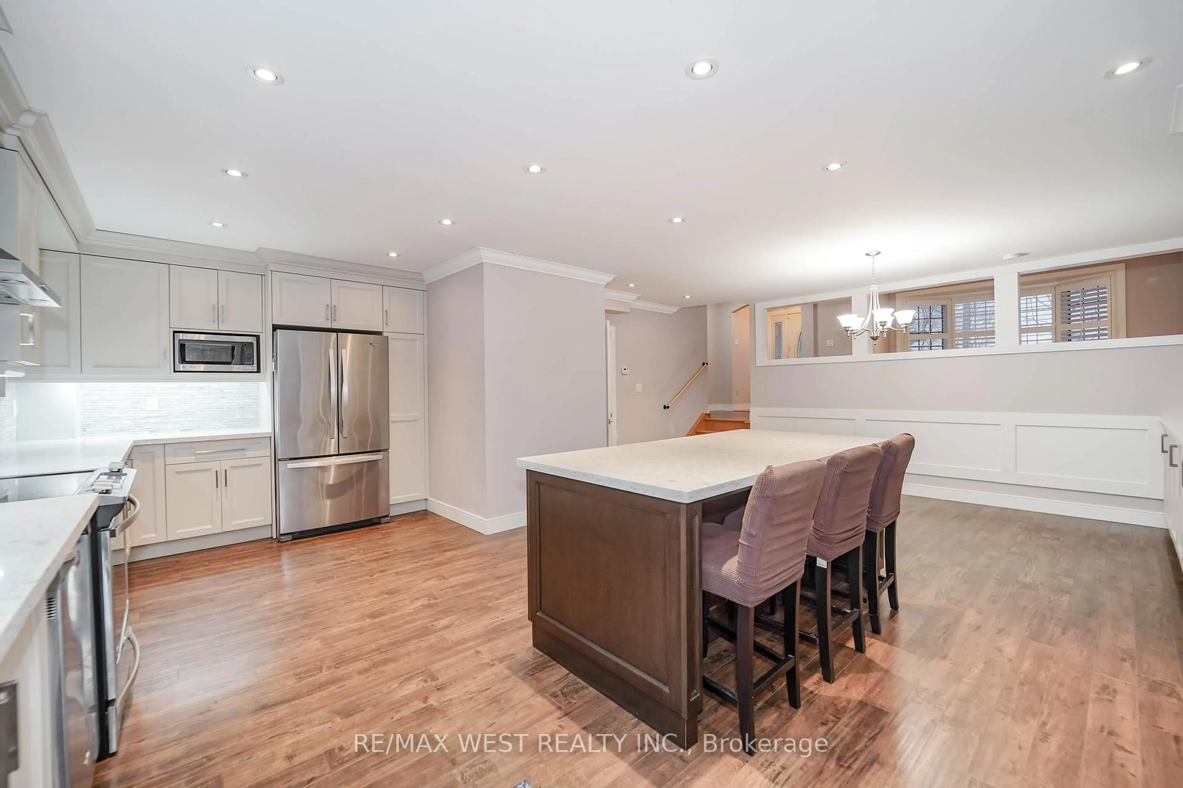 Open concept kitchen, wood/laminate floor for 43 Dunsany Cres, Toronto Ontario M9R 3W7