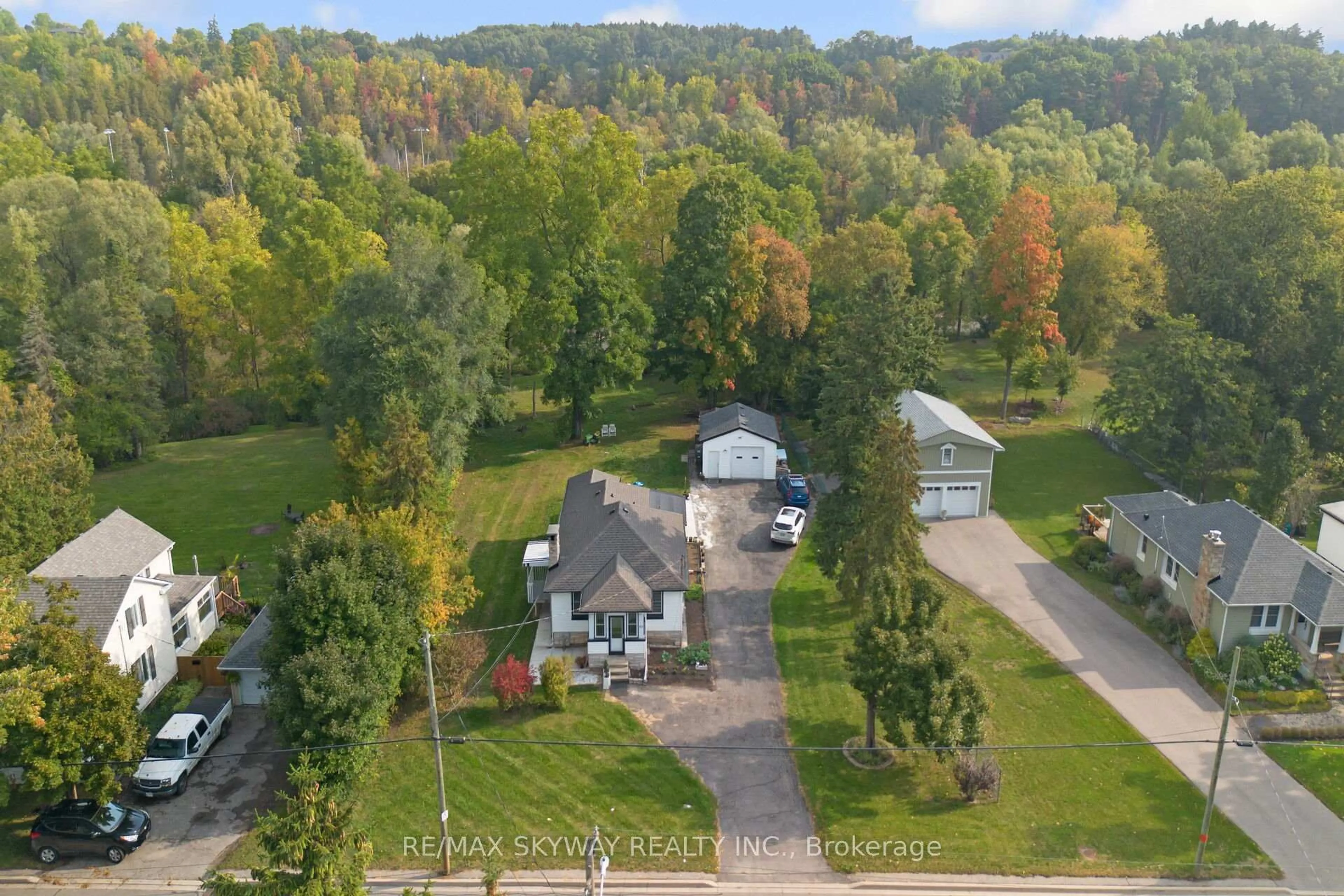 A pic from outside/outdoor area/front of a property/back of a property/a pic from drone, forest/trees view for 45 Confederation St, Halton Hills Ontario L7G 3R4