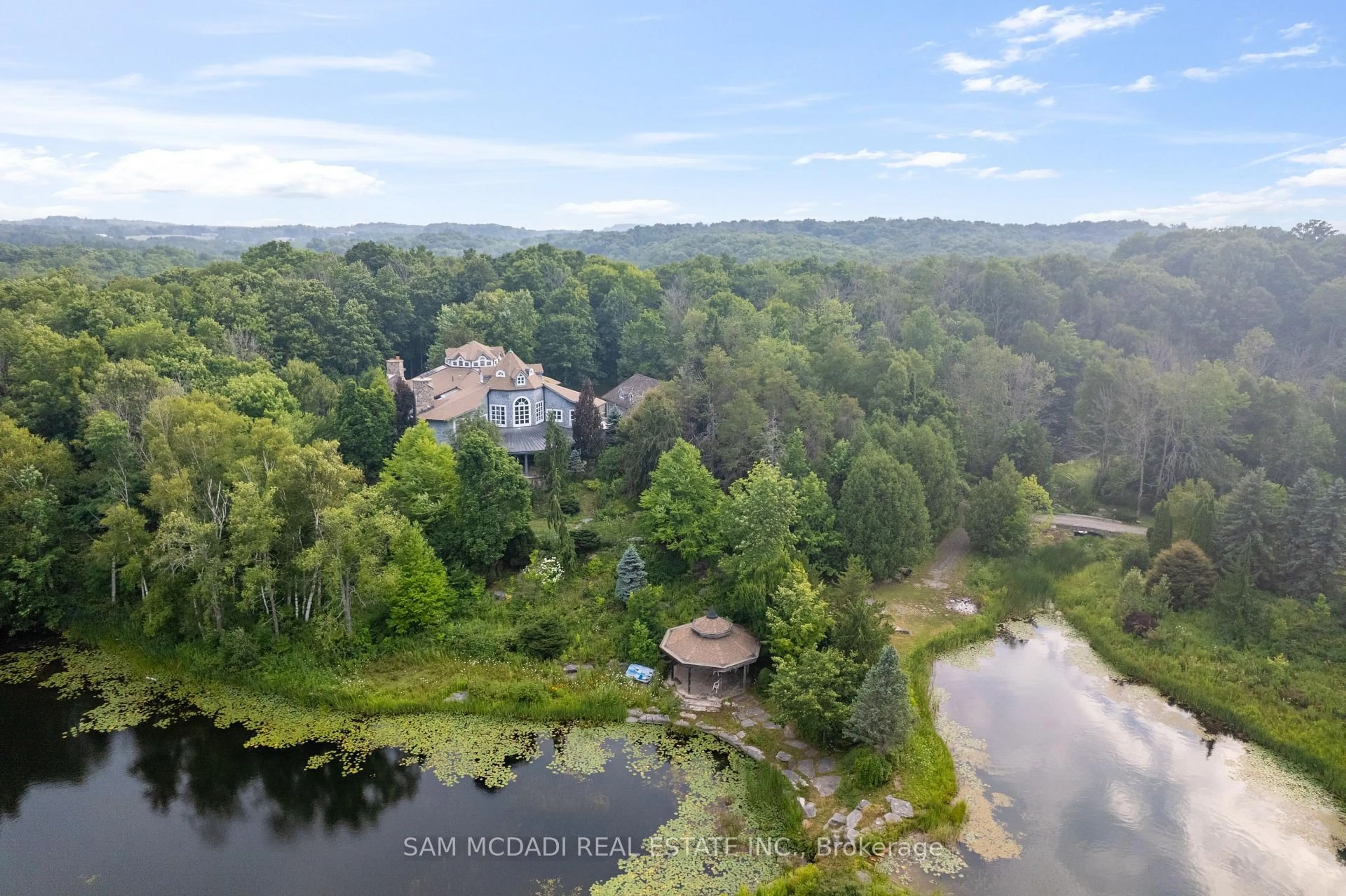 A pic from outside/outdoor area/front of a property/back of a property/a pic from drone, water/lake/river/ocean view for 9 Flaherty Lane, Caledon Ontario L7K 2P2