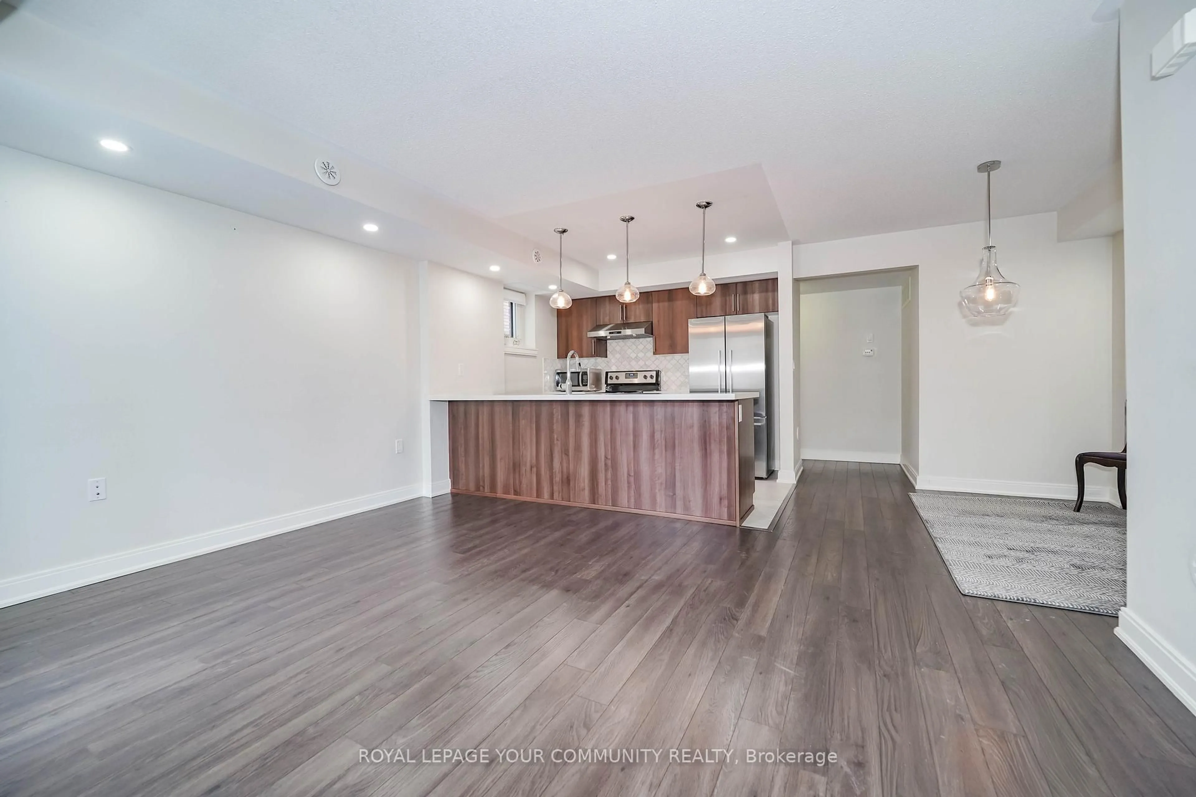 Open concept kitchen, wood/laminate floor for 100 Dufay Rd #41, Brampton Ontario L7A 4S3