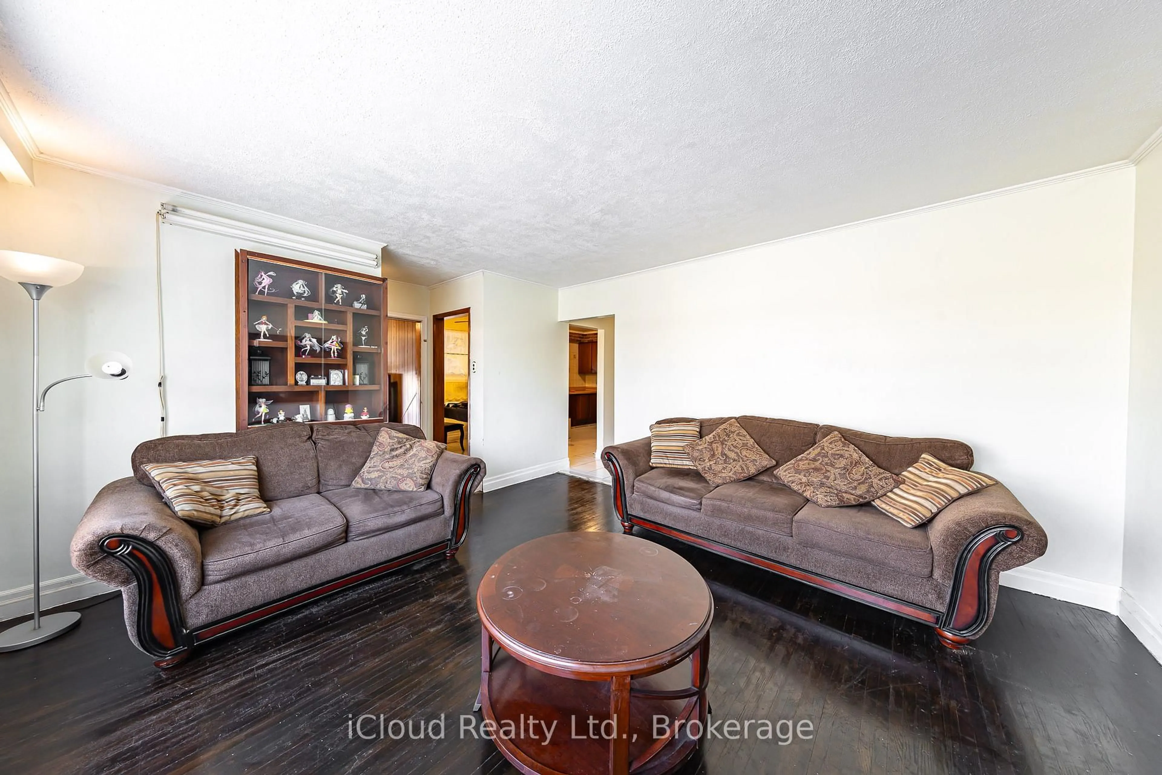 Living room with furniture, wood/laminate floor for 25 Monterrey Dr, Toronto Ontario M9V 1S7