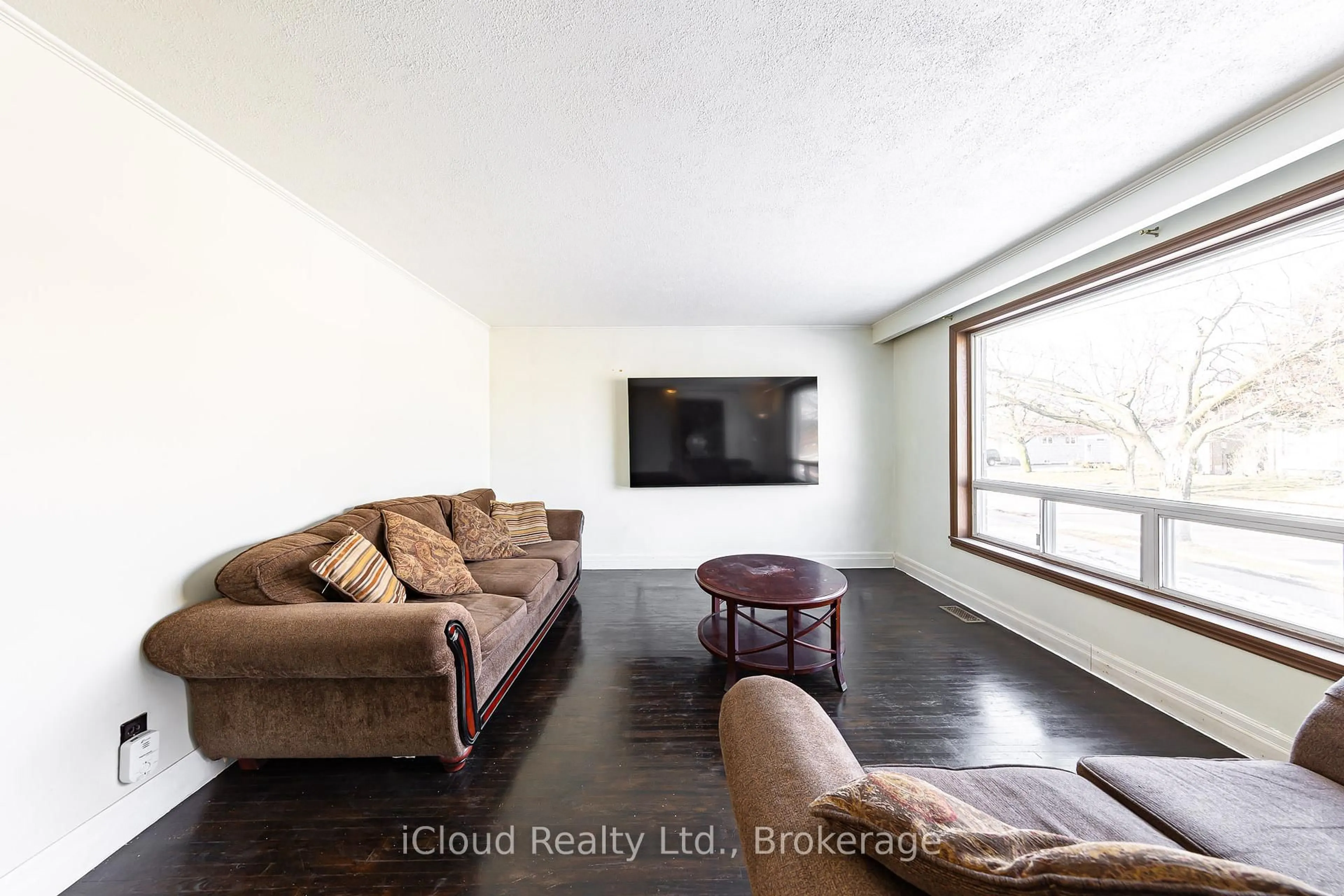 Living room with furniture, wood/laminate floor for 25 Monterrey Dr, Toronto Ontario M9V 1S7