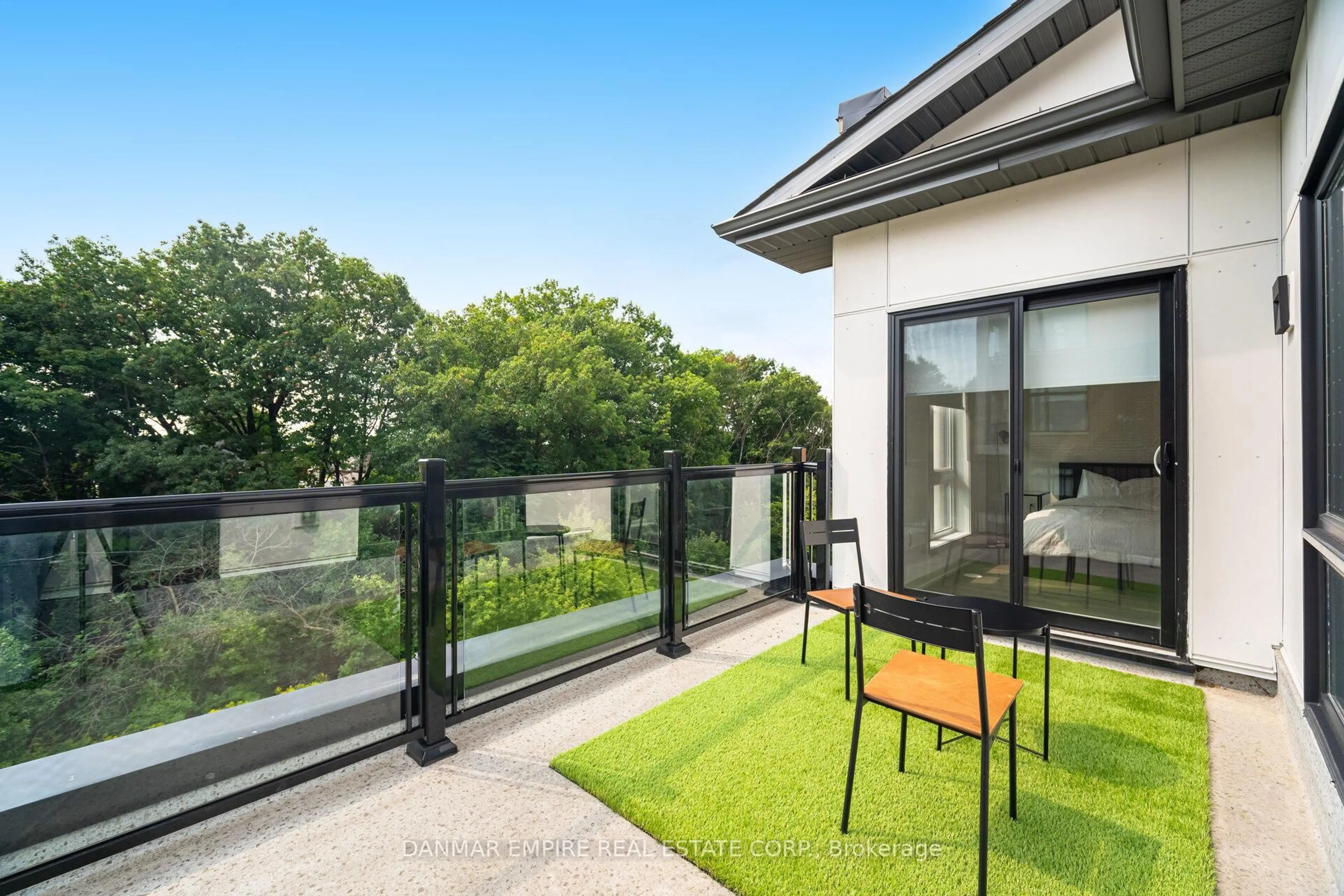 Patio, city buildings view from balcony for 155 Canon Jackson Dr Dr #206, Toronto Ontario M6M 0E1