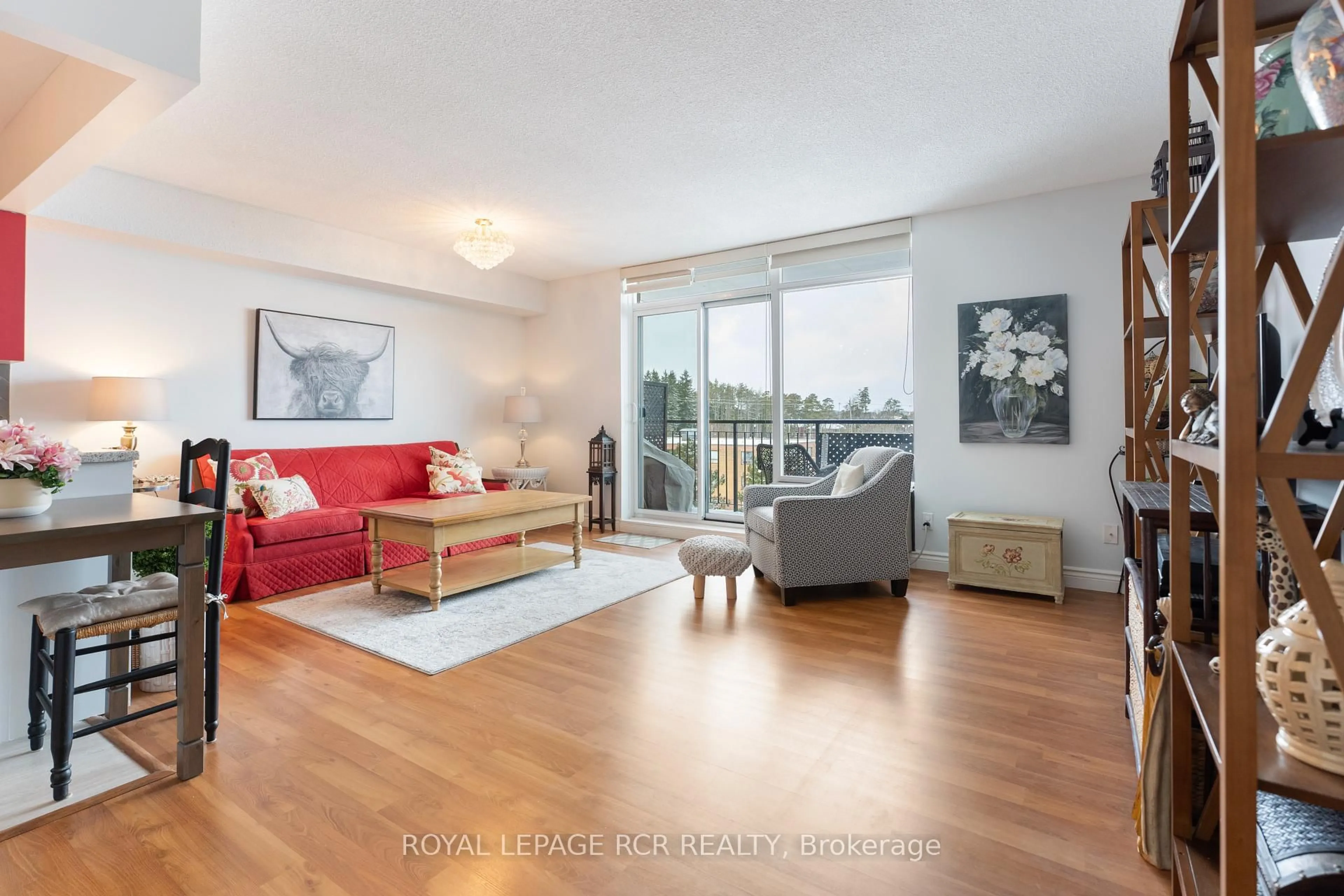 Living room with furniture, wood/laminate floor for 16 Fourth St #47, Orangeville Ontario L9W 4N7