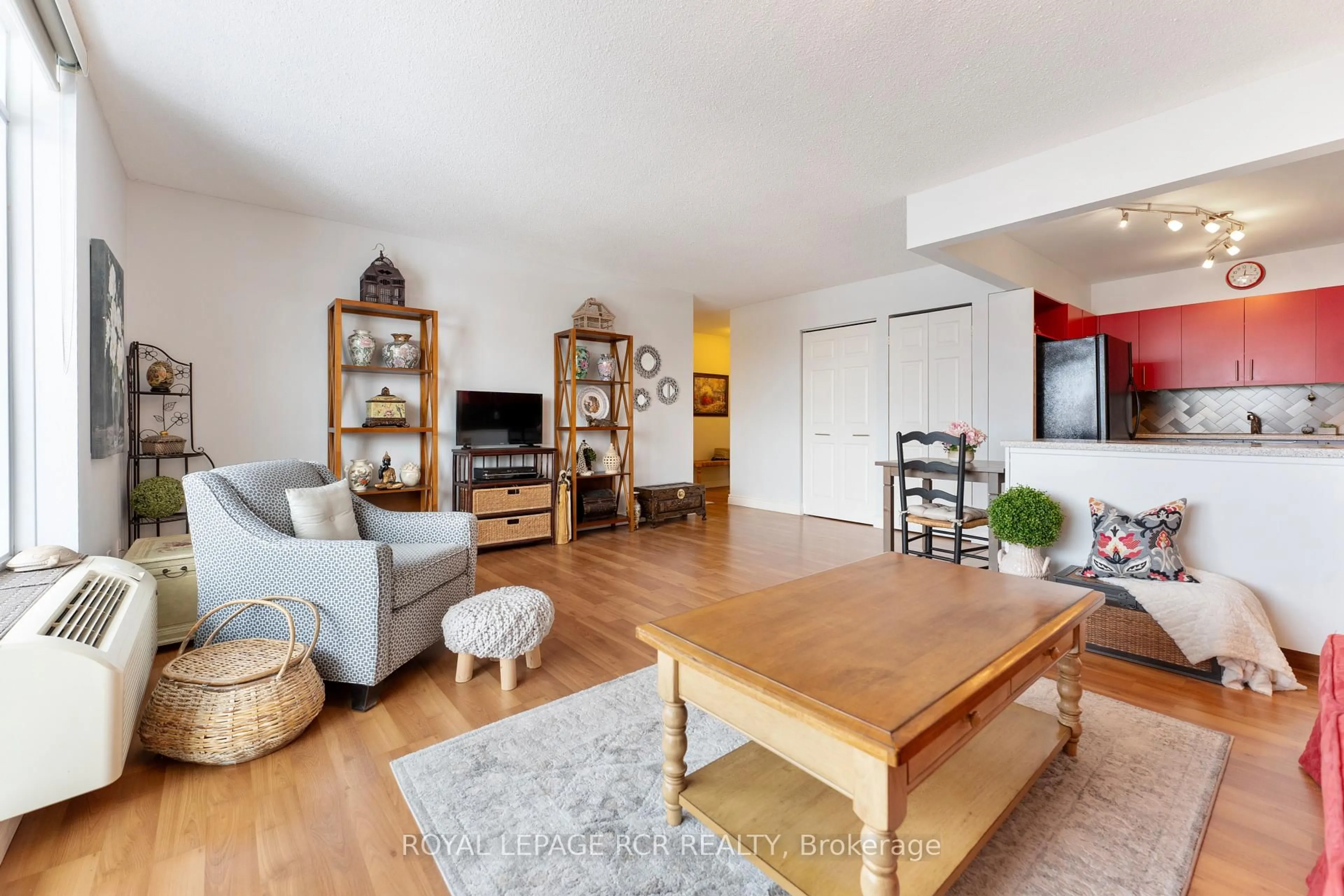 Living room with furniture, wood/laminate floor for 16 Fourth St #47, Orangeville Ontario L9W 4N7