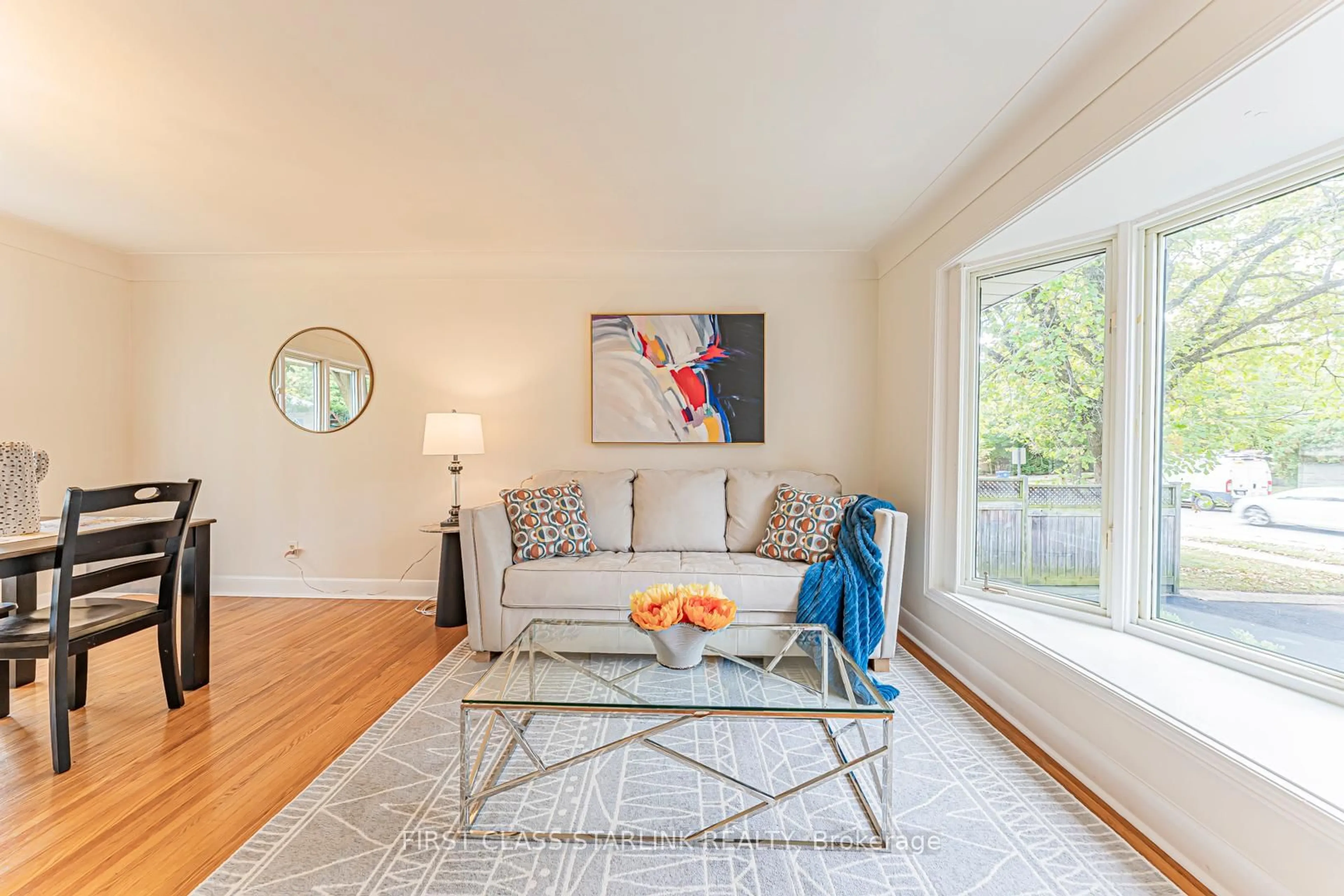 Living room with furniture, wood/laminate floor for 621 Dynes Rd, Burlington Ontario L7N 2V4