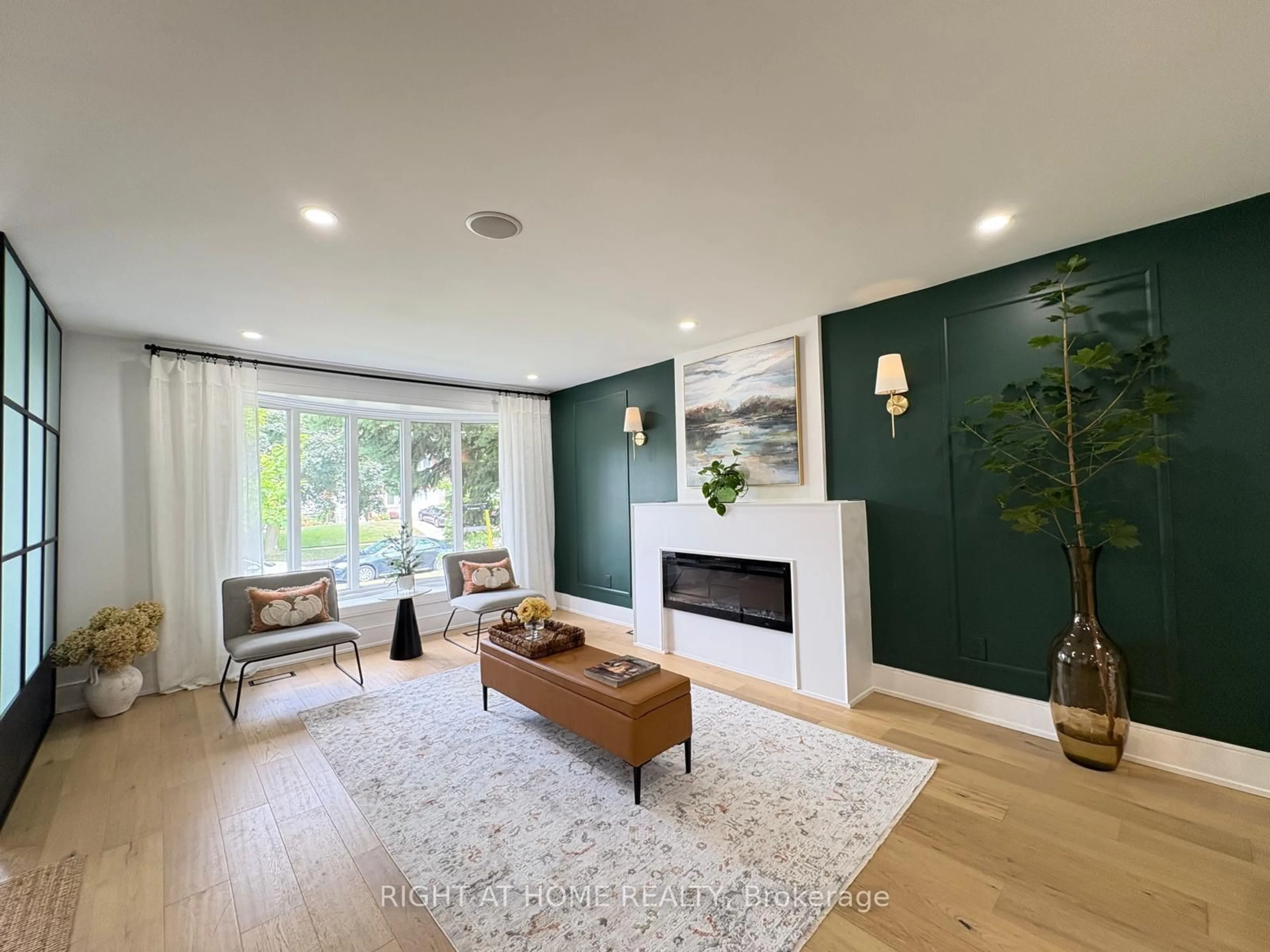 Living room with furniture, wood/laminate floor for 23 Drury Lane, Toronto Ontario M9P 1P8