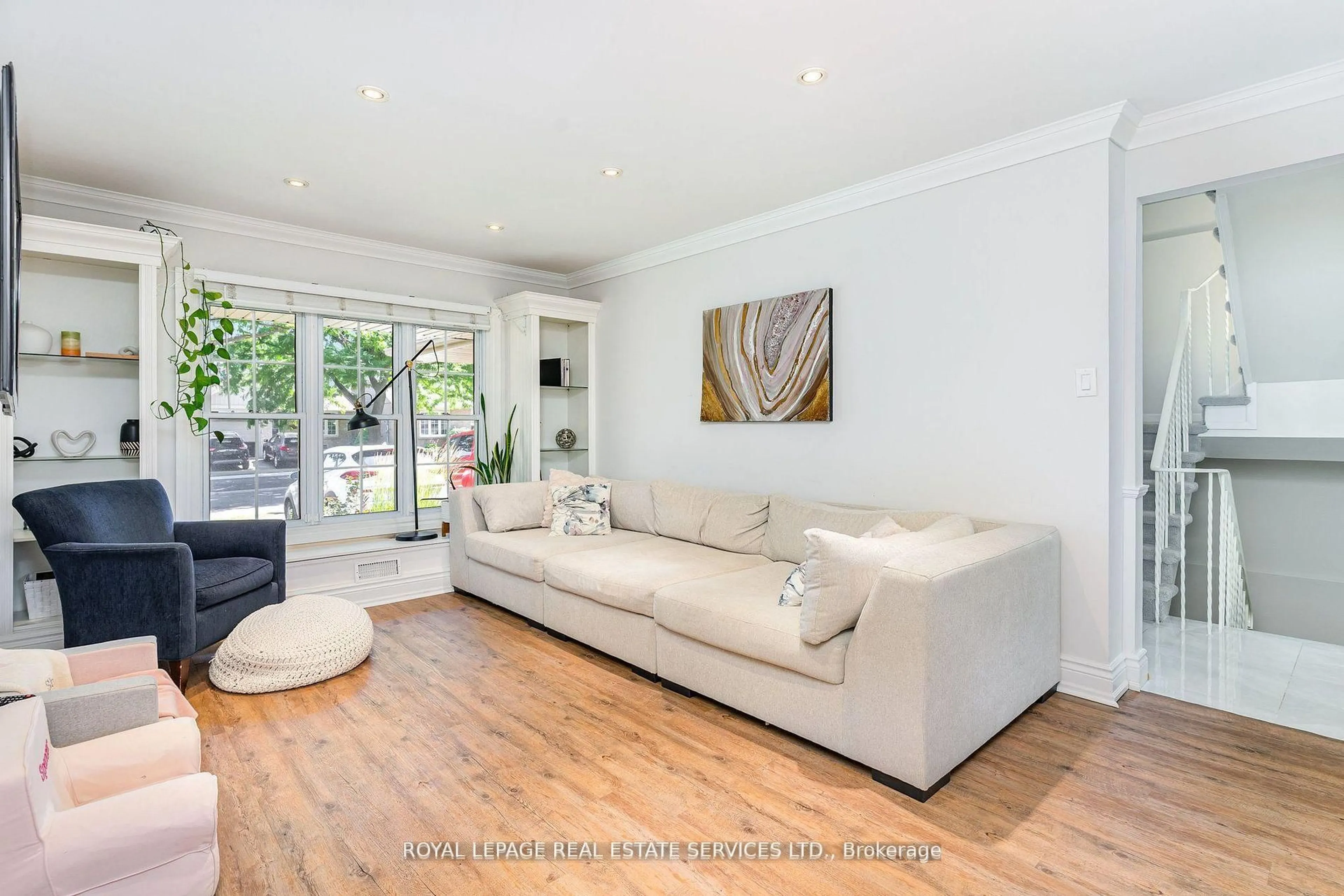 Living room with furniture, wood/laminate floor for 47 Lafferty St, Toronto Ontario M9C 5B5