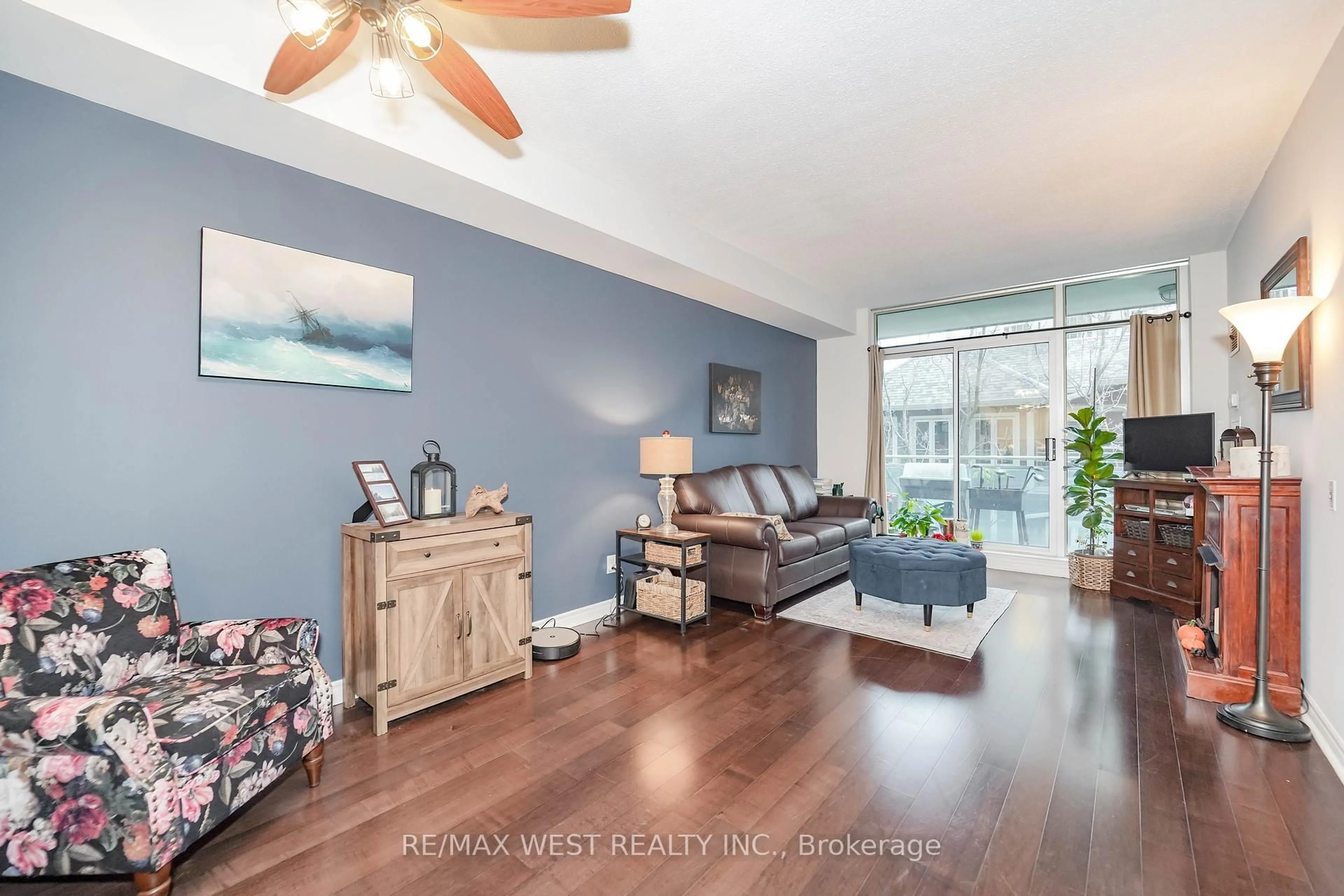 Living room with furniture, wood/laminate floor for 5 Marine Parade Dr #319, Toronto Ontario M8V 4B4