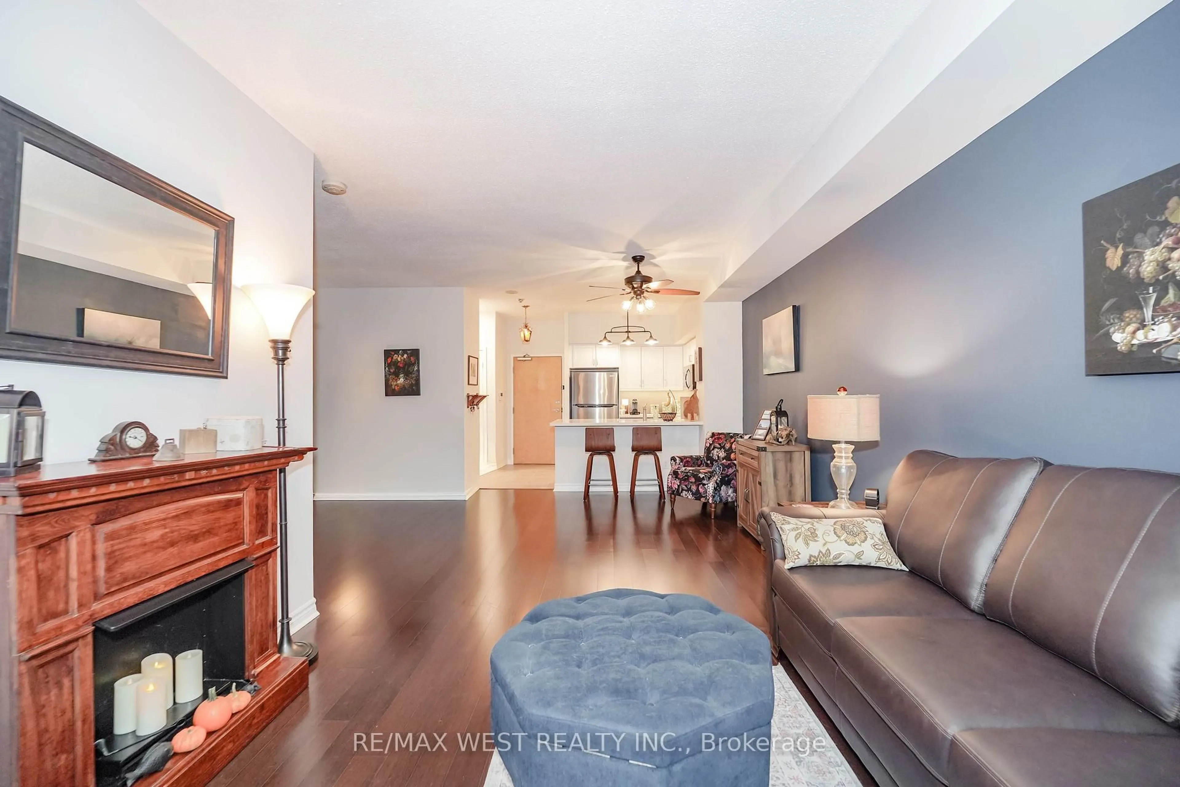 Living room with furniture, wood/laminate floor for 5 Marine Parade Dr #319, Toronto Ontario M8V 4B4