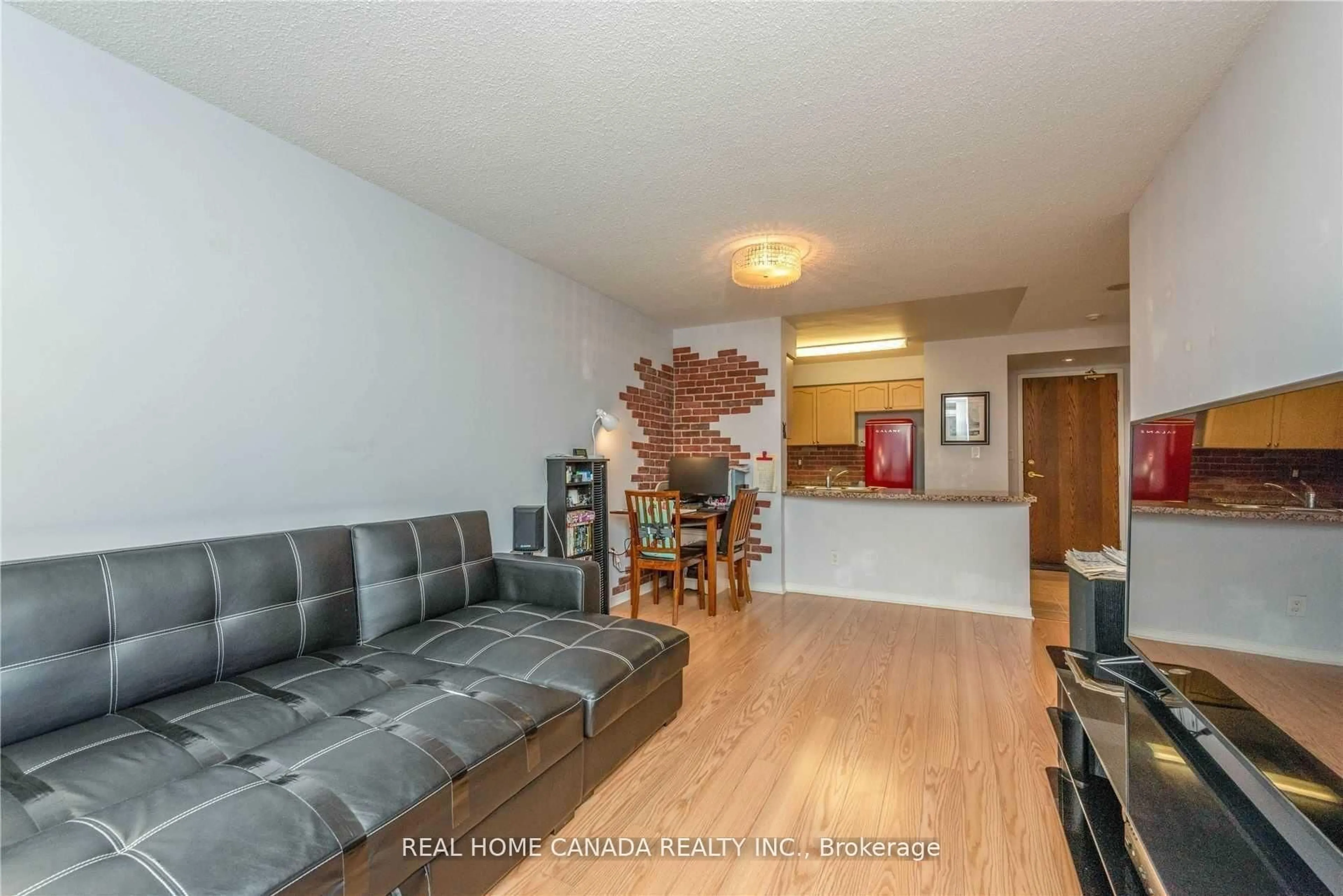 Living room with furniture, wood/laminate floor for 4850 Glen Erin Dr #706, Mississauga Ontario L5M 7S1