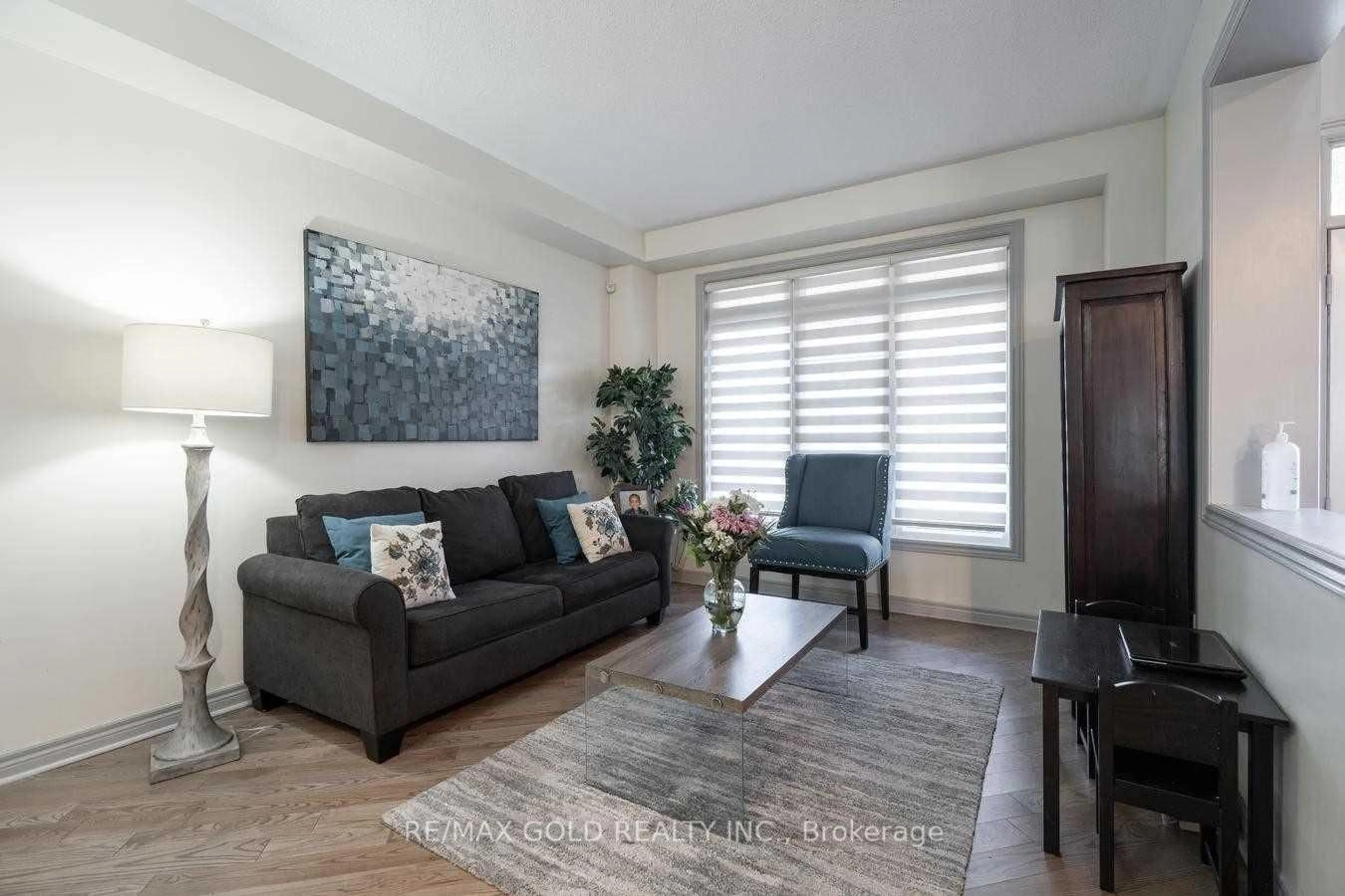 Living room with furniture, wood/laminate floor for 42 Dolly Varden, Brampton Ontario L6R 3L3