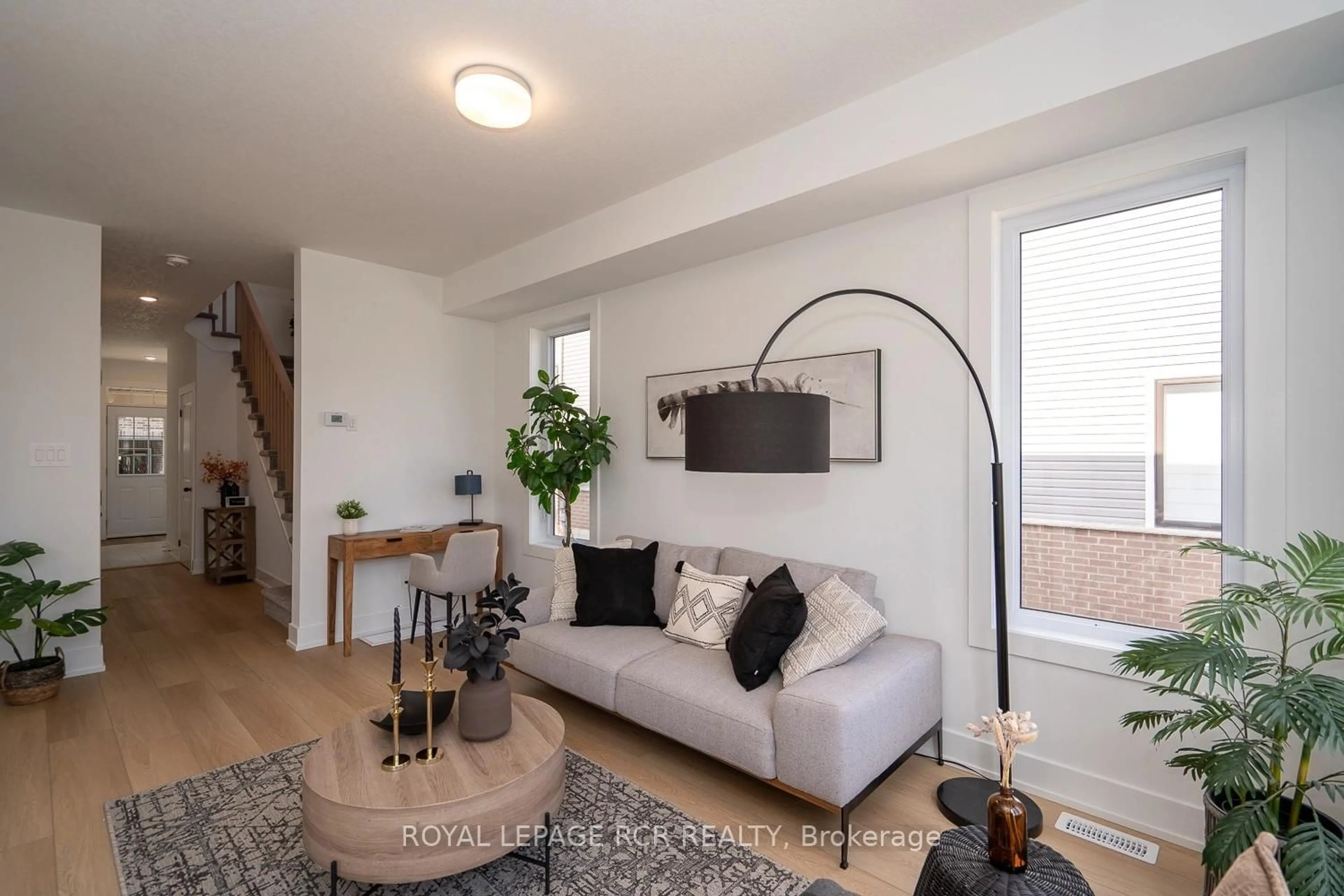 Living room with furniture, wood/laminate floor for 690 Broadway Ave #8, Orangeville Ontario L9W 7T7