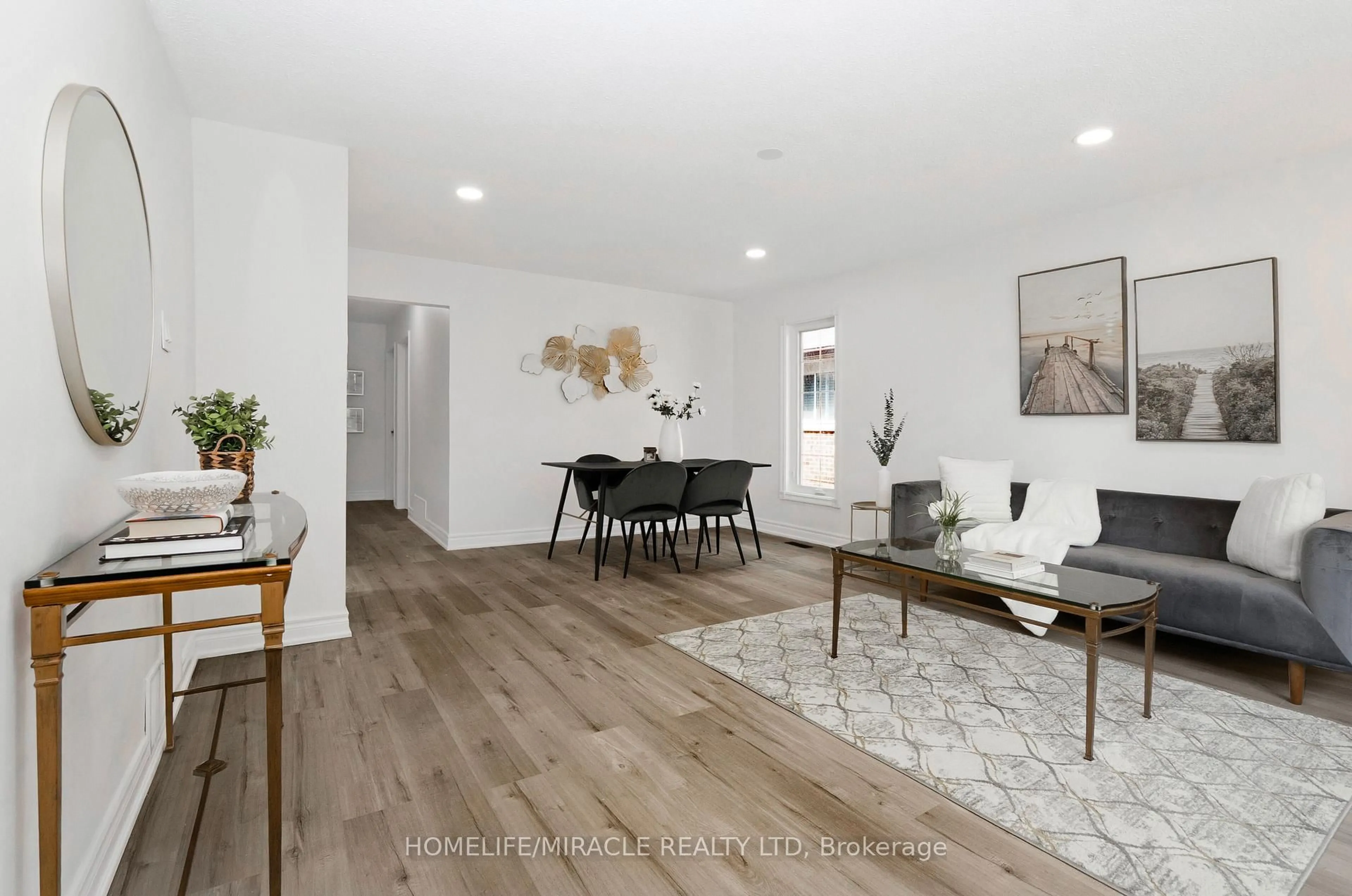 Living room with furniture, wood/laminate floor for 66 Avening Dr, Toronto Ontario M9V 1Y1