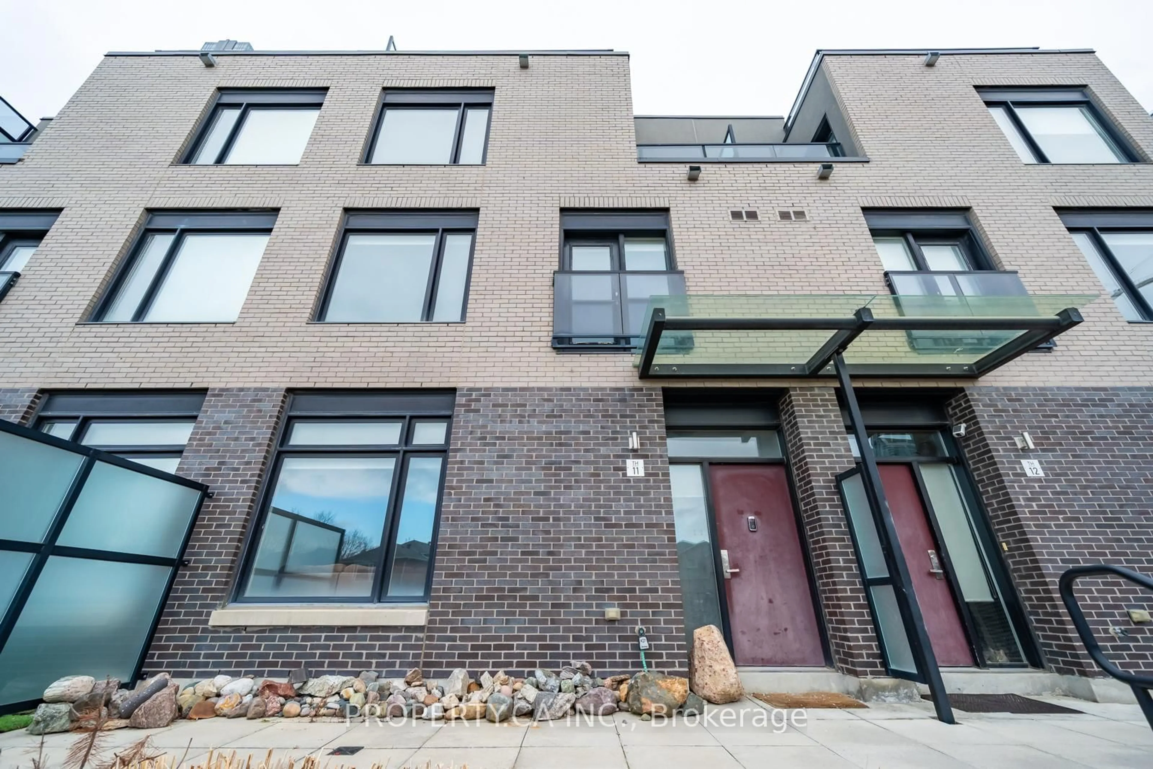 Home with brick exterior material, street for 4030 Parkside Village Dr #11, Mississauga Ontario L5B 3M1