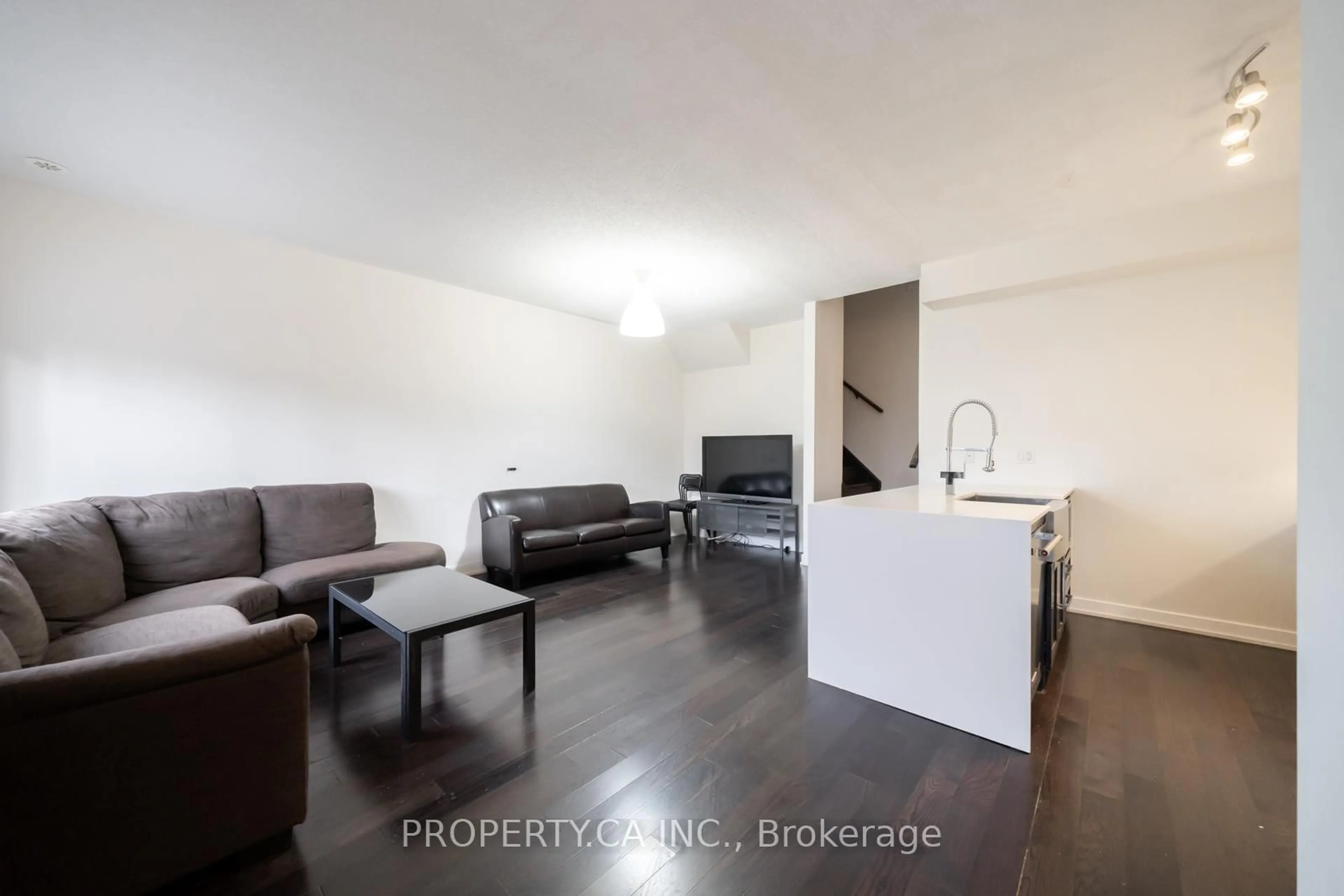 Living room with furniture, wood/laminate floor for 4030 Parkside Village Dr #11, Mississauga Ontario L5B 3M1