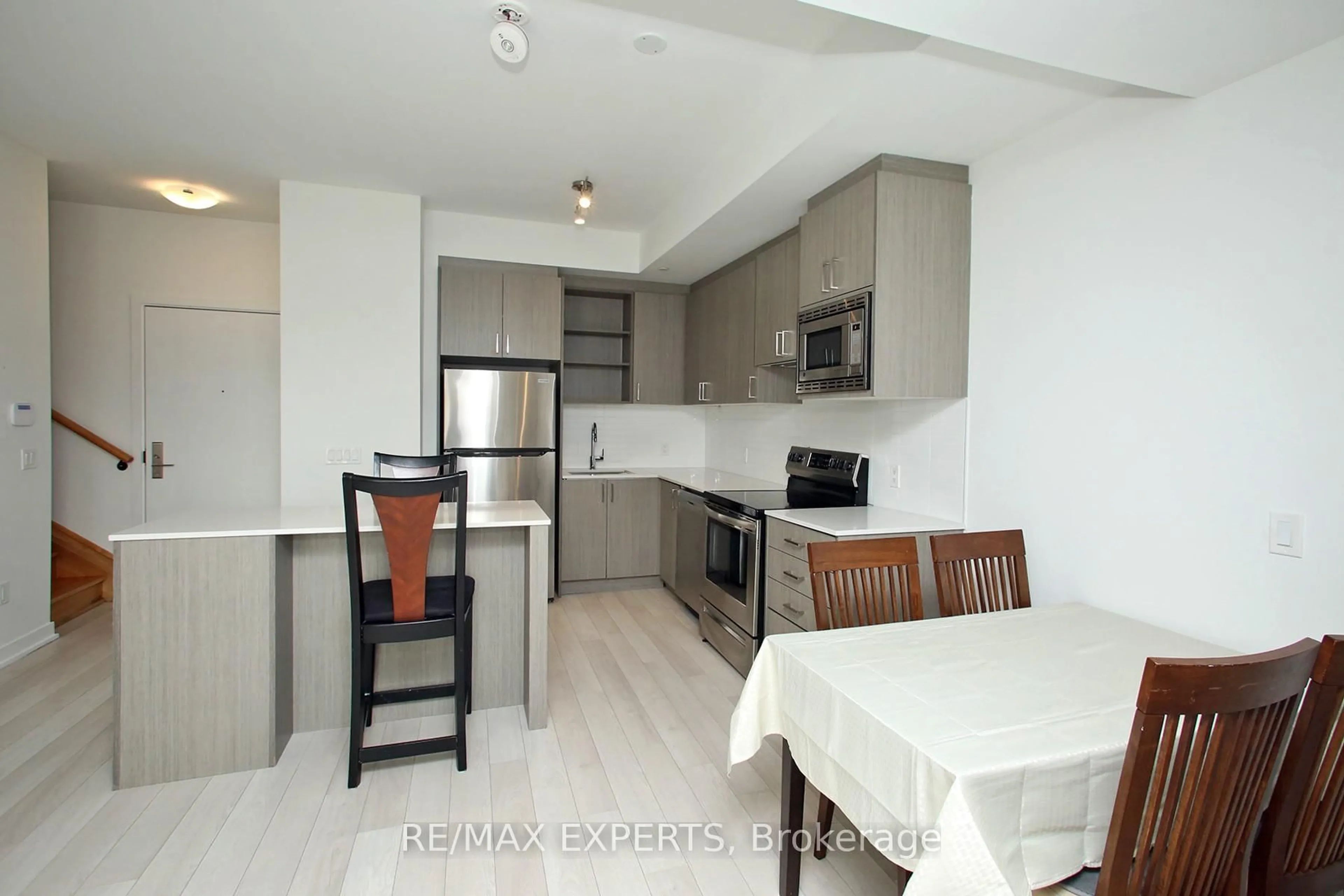 Open concept kitchen, wood/laminate floor for 155 Downsview Park Blvd #115, Toronto Ontario M3K 0E3