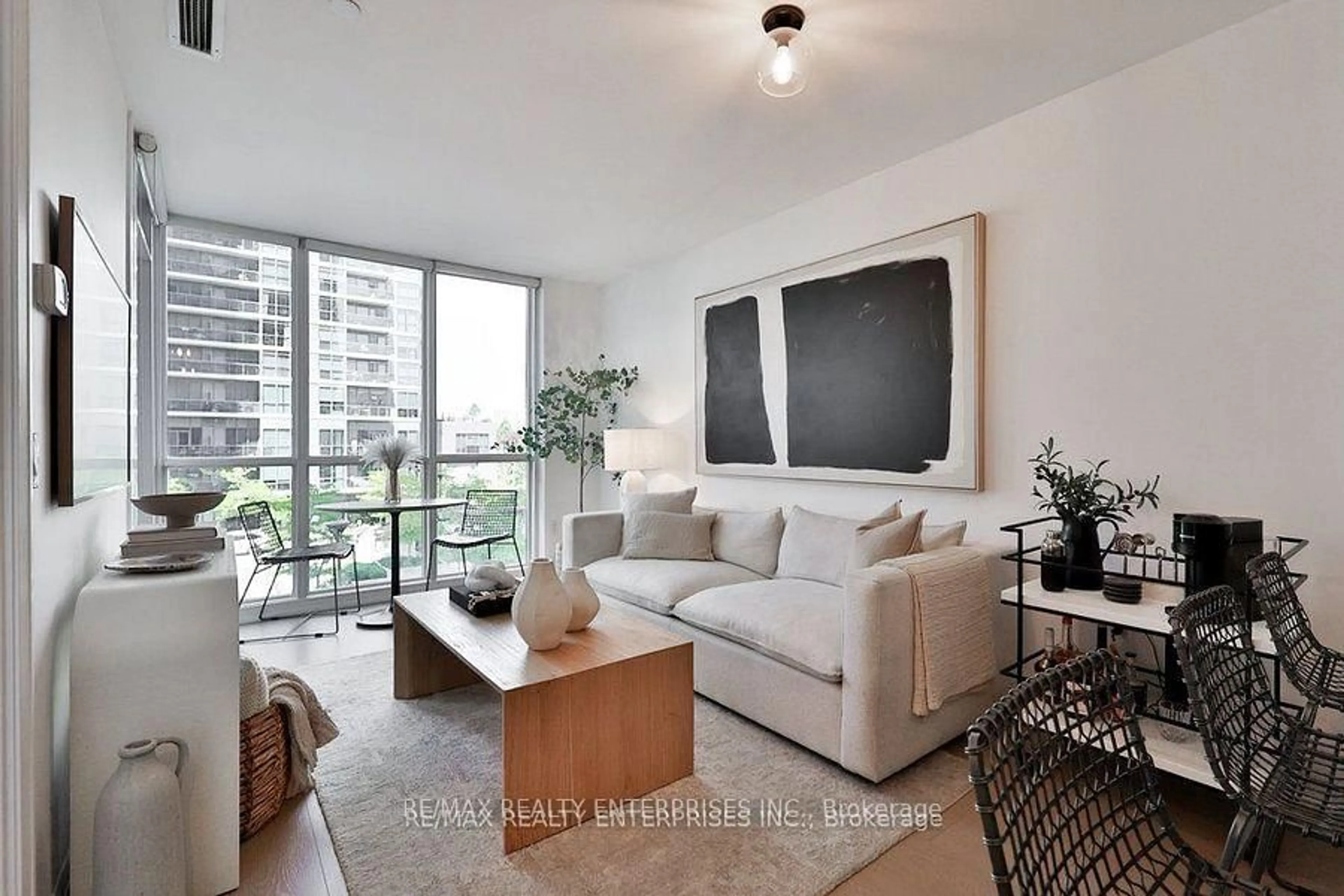 Living room with furniture, wood/laminate floor for 9 Valhalla Inn Rd #306, Toronto Ontario M9B 1S9