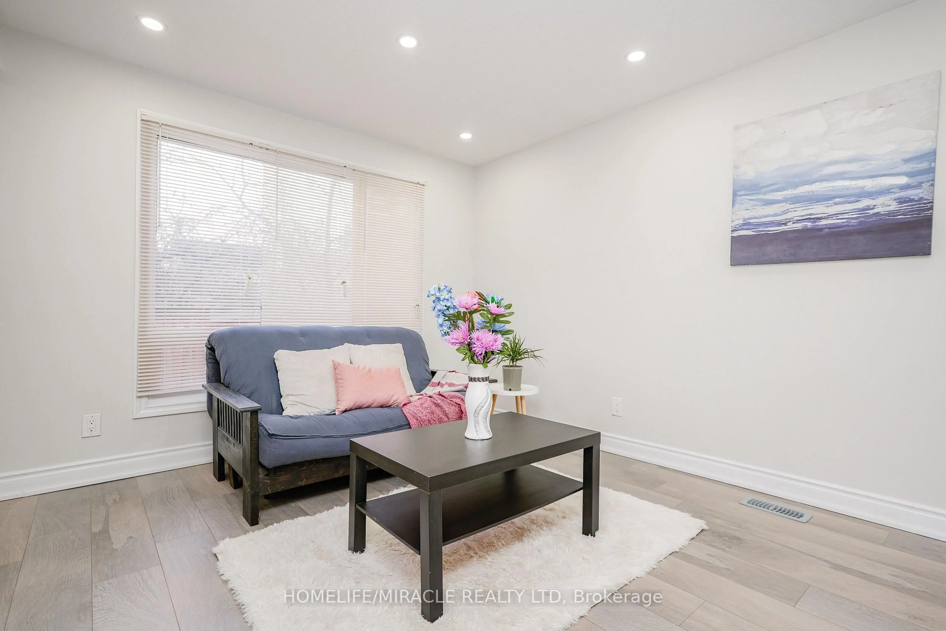 Living room with furniture, wood/laminate floor for 15 Heatherside Crt, Brampton Ontario L6S 1N9