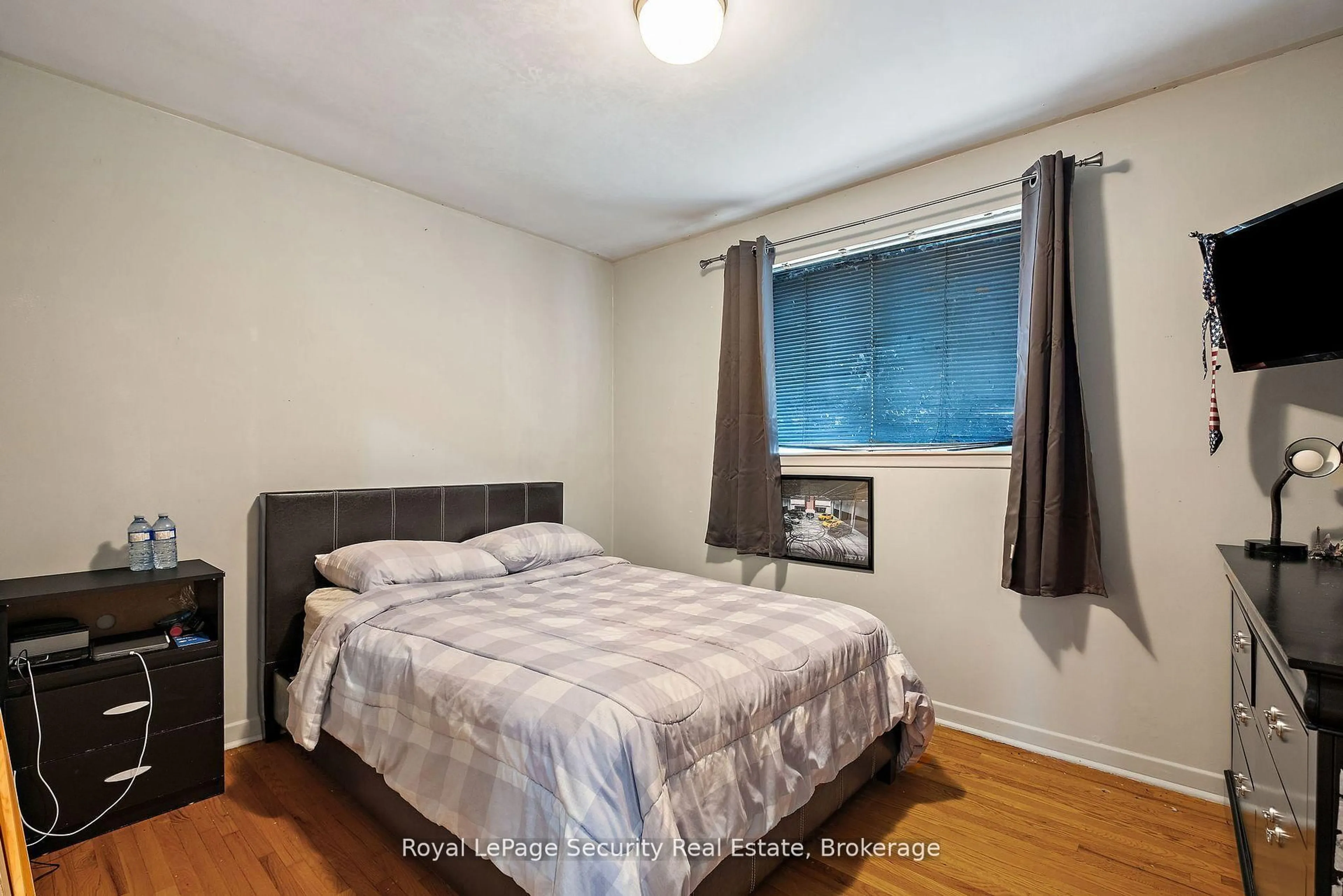 Bedroom with bed, wood/laminate floor for 27 Belleglade Crt, Toronto Ontario M9M 2W3