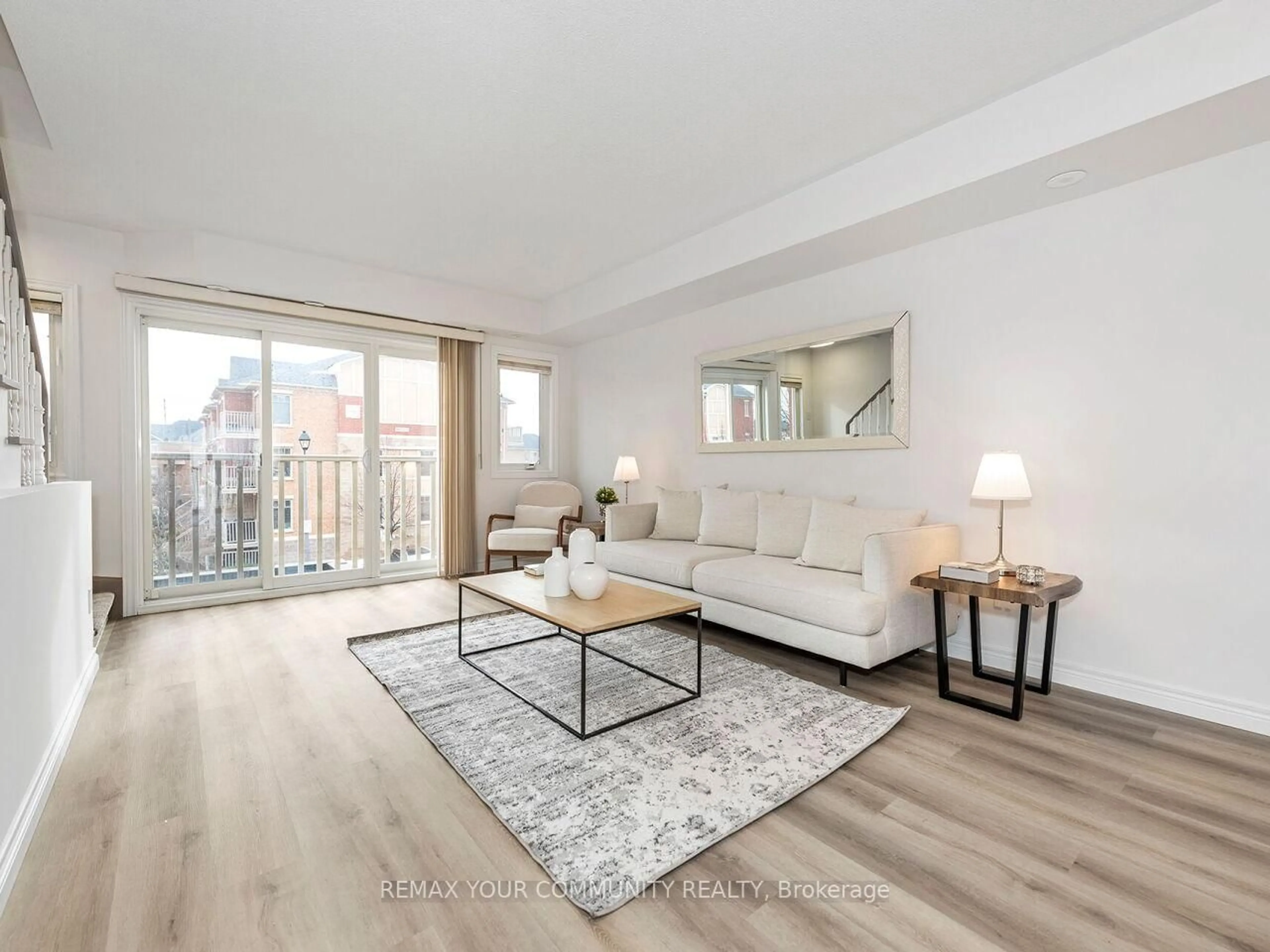 Living room with furniture, wood/laminate floor for 5050 Intrepid Dr #7, Mississauga Ontario L5M 0E5