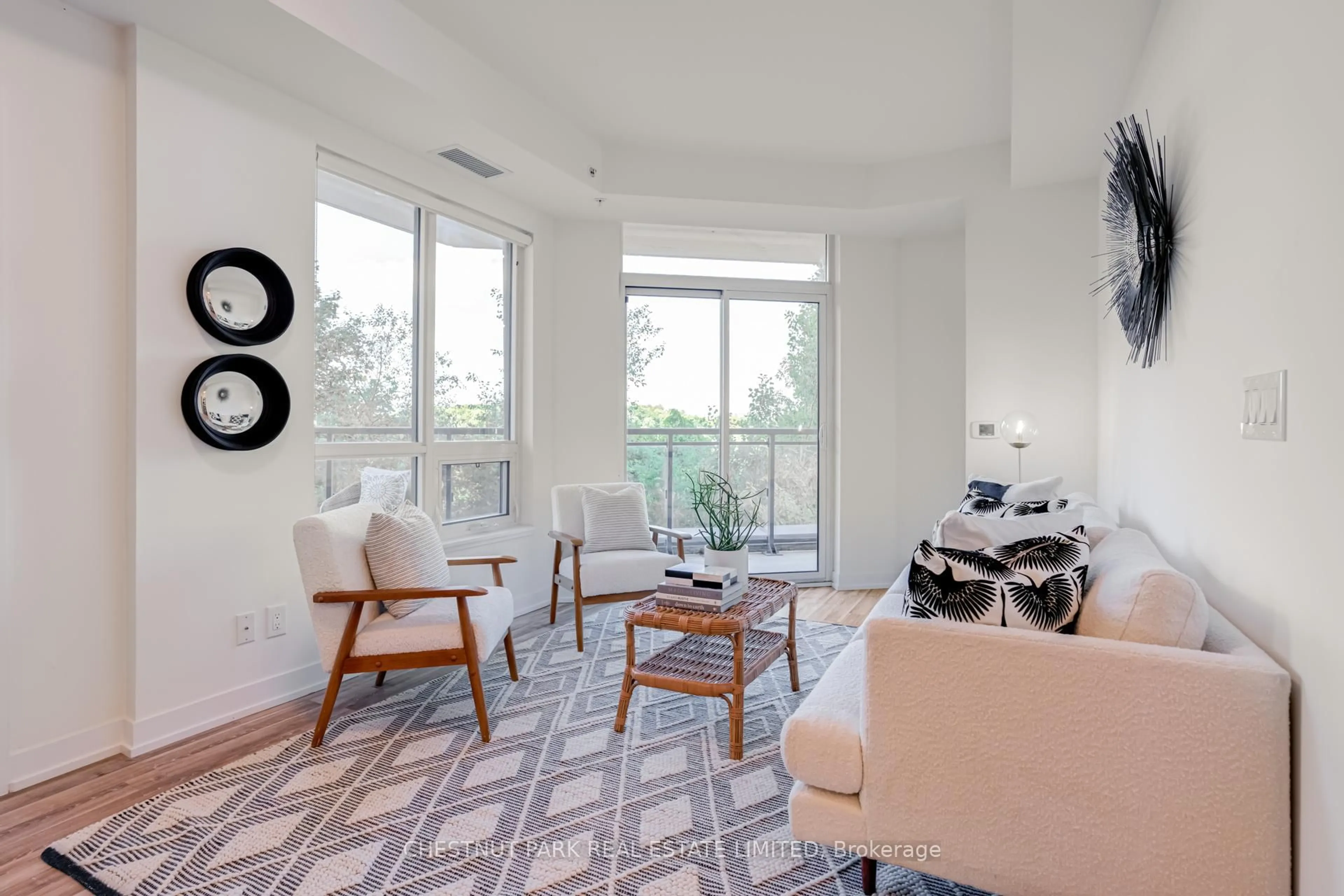 Living room with furniture, unknown for 840 Queens Plate Dr #205, Toronto Ontario M9W 0E7