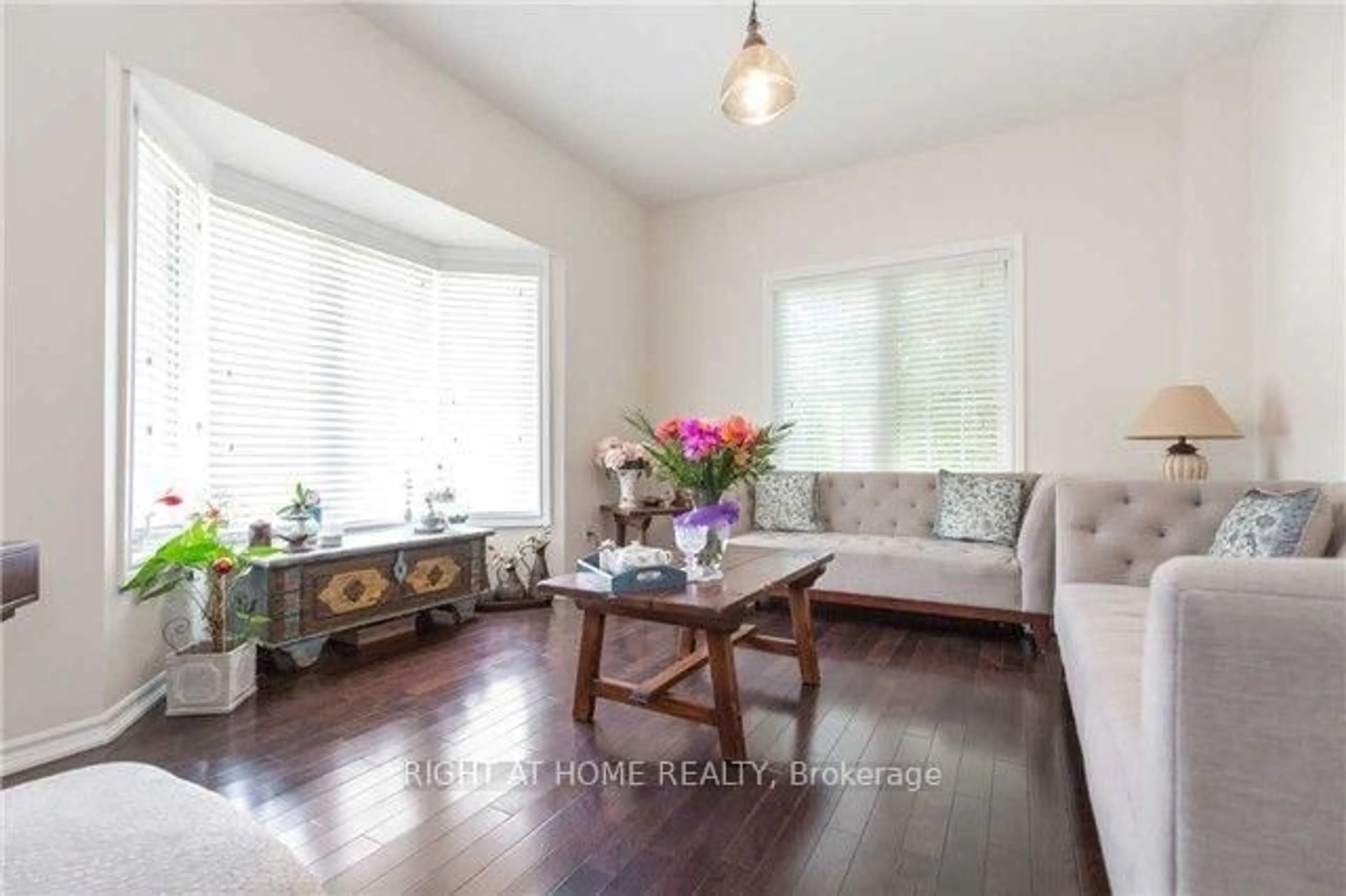 Living room with furniture, wood/laminate floor for 1074 Mccuaig Dr, Milton Ontario L9T 6T2