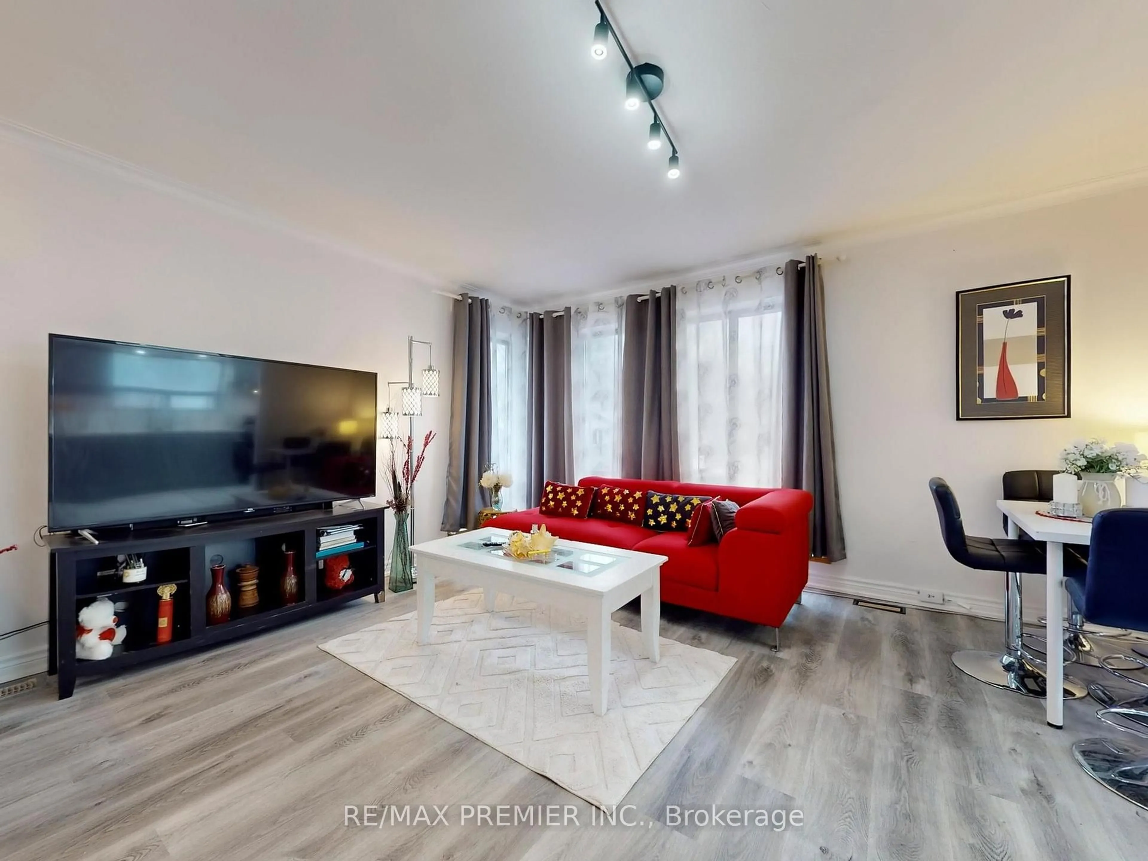 Living room with furniture, wood/laminate floor for 30 Moncrieff Dr, Toronto Ontario M9W 2R2