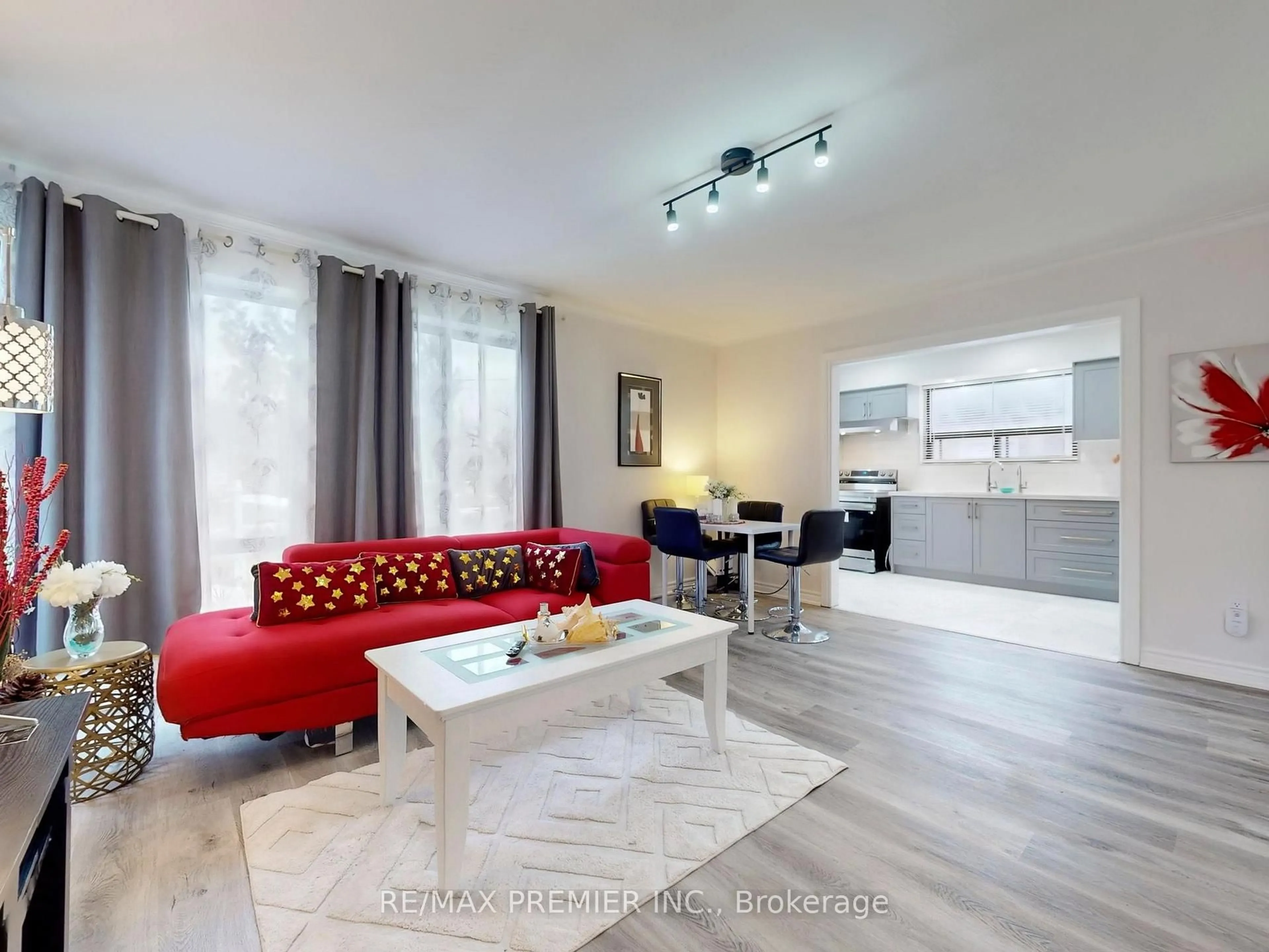 Living room with furniture, wood/laminate floor for 30 Moncrieff Dr, Toronto Ontario M9W 2R2