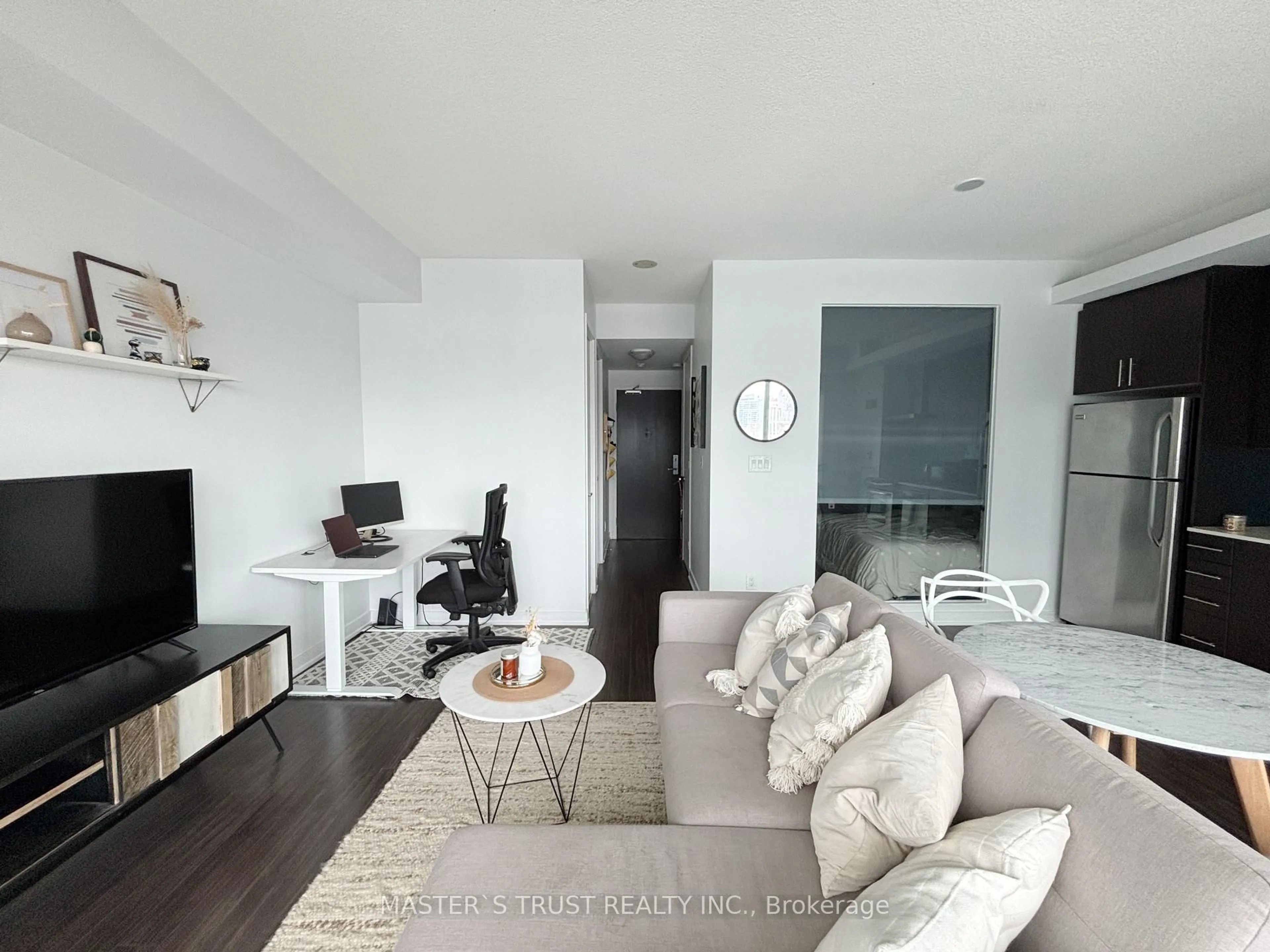 Living room with furniture, wood/laminate floor for 165 Legion Rd #1025, Toronto Ontario M8Y 0B3