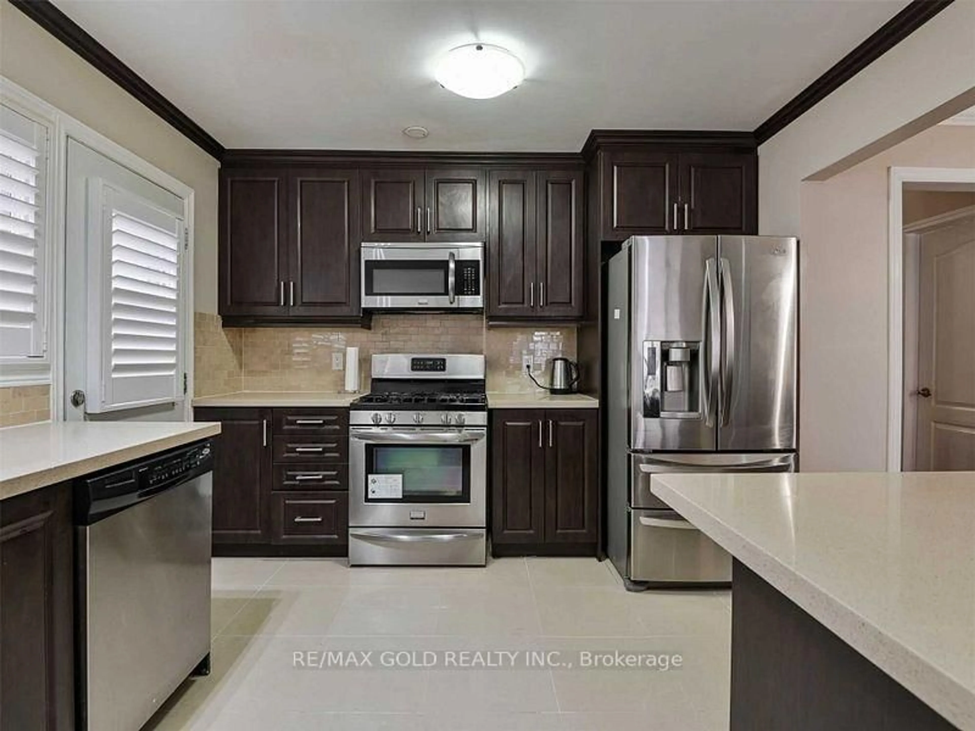 Standard kitchen, ceramic/tile floor for 67 Archdekin Dr, Brampton Ontario L6V 1V1