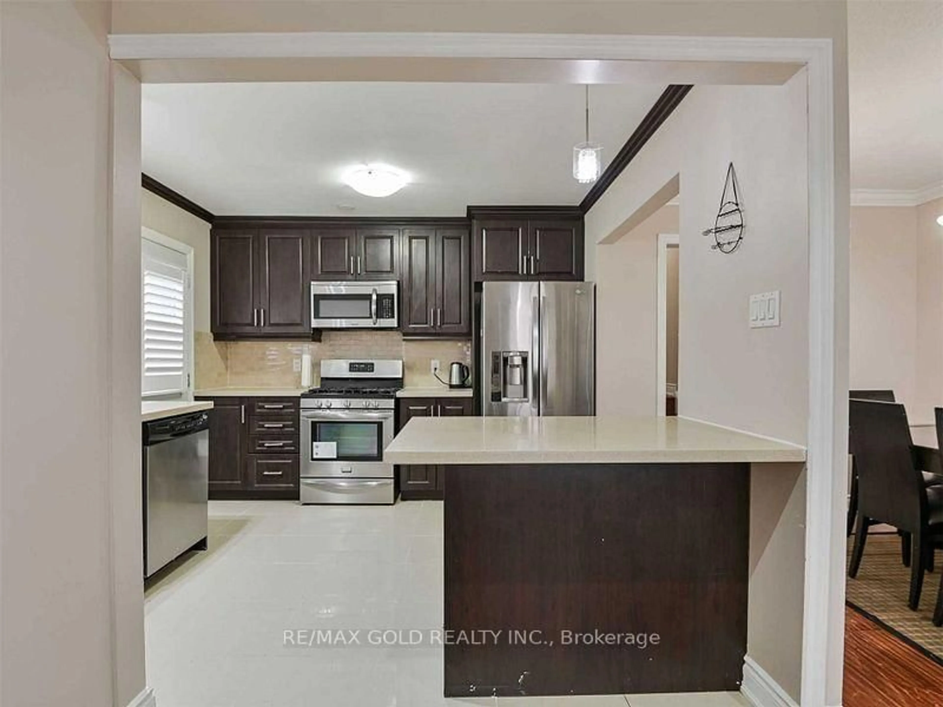 Open concept kitchen, ceramic/tile floor for 67 Archdekin Dr, Brampton Ontario L6V 1V1