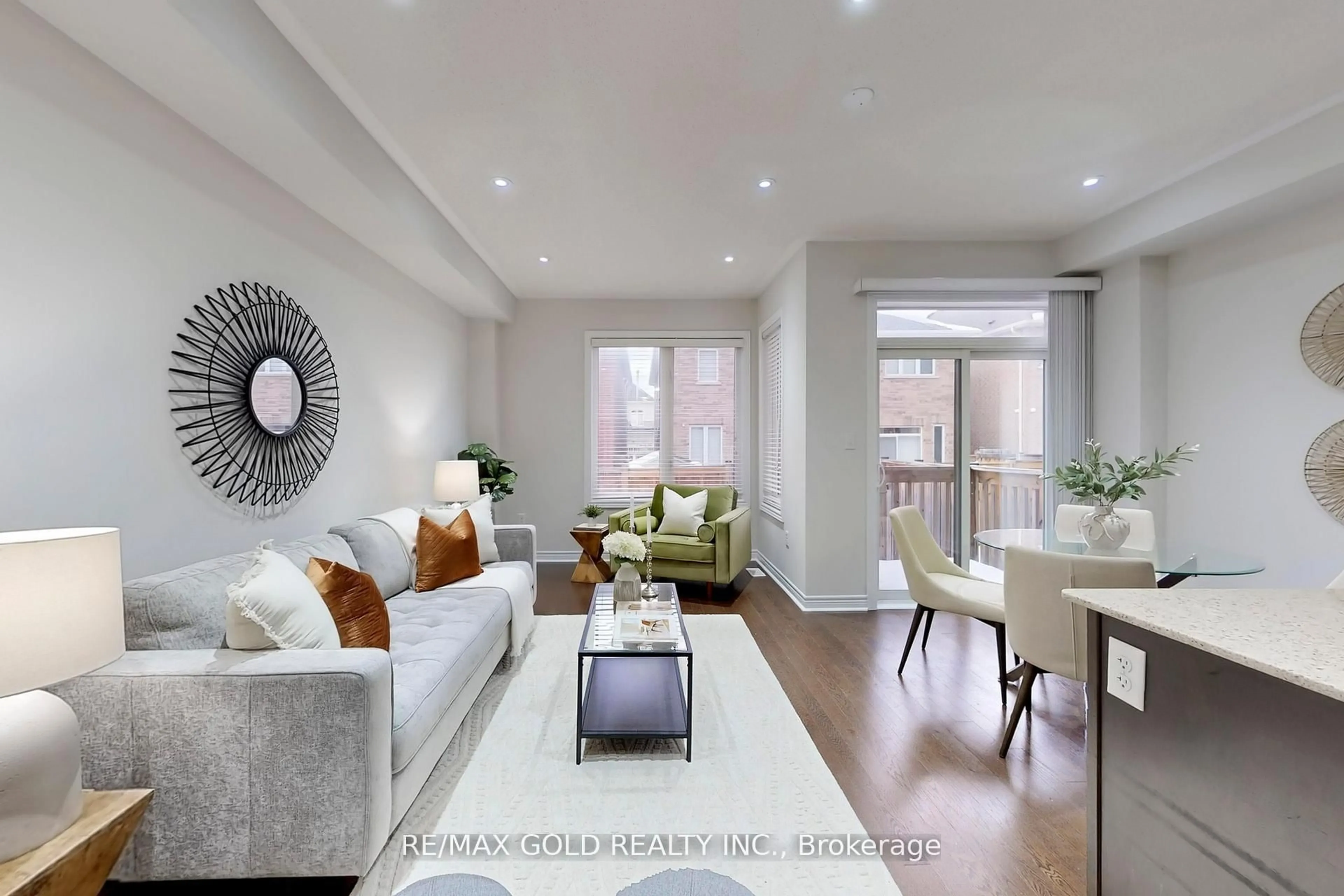 Living room with furniture, wood/laminate floor for 62 Pennycross Cres, Brampton Ontario L7A 4M1