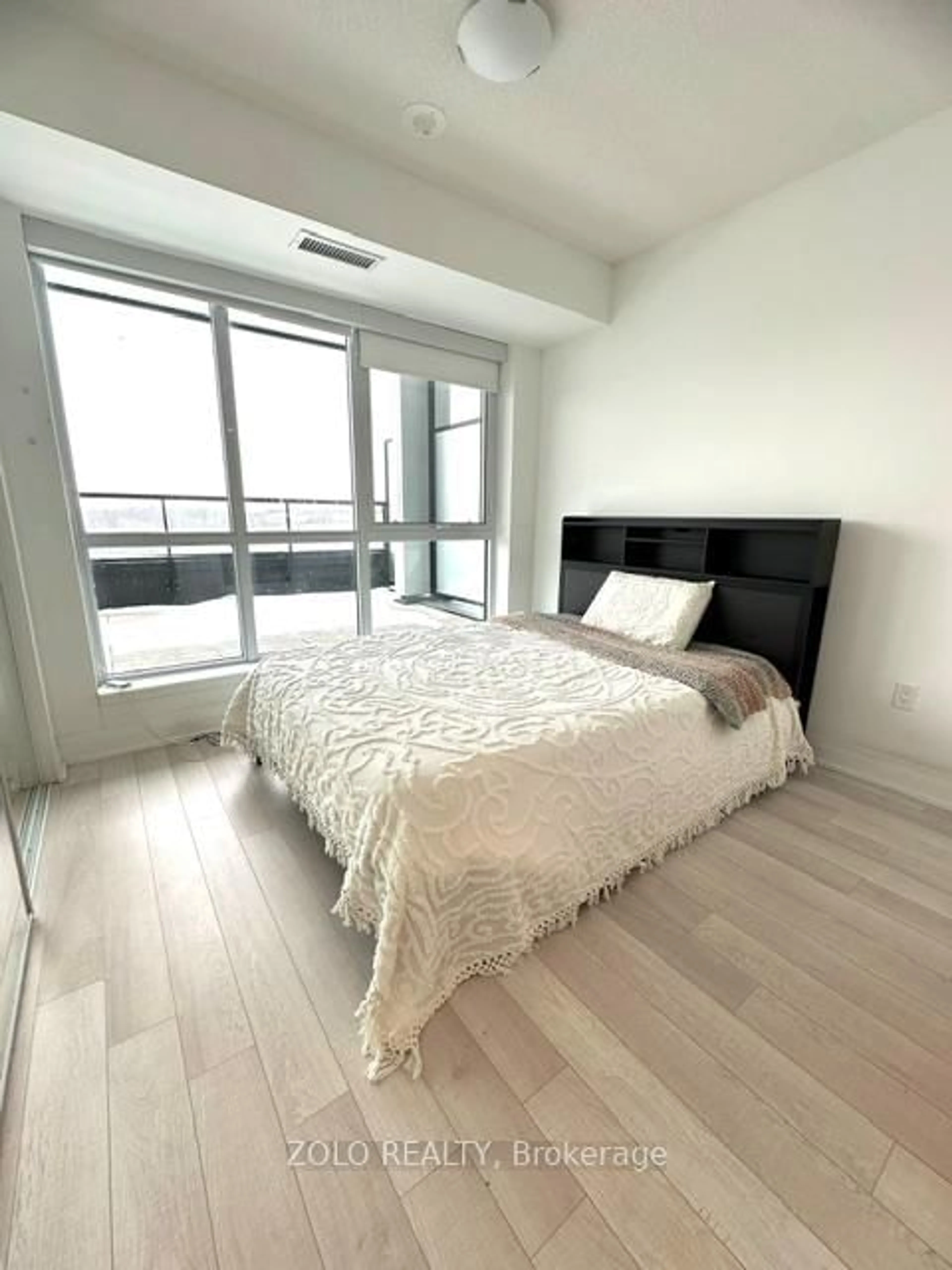Bedroom with bed, wood/laminate floor for 60 George Butchart Dr #421, Toronto Ontario M3K 2C5