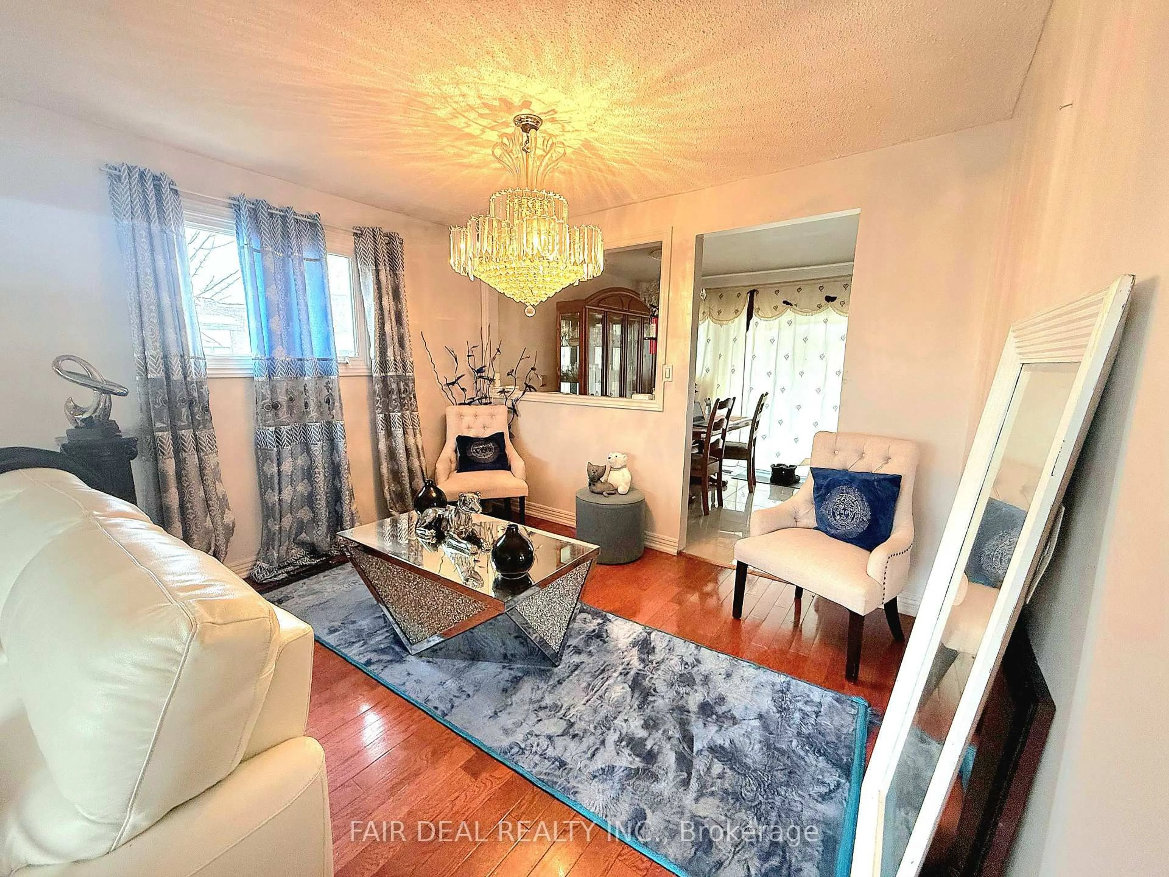 Living room with furniture, unknown for 3720 Brandon Gate Dr, Mississauga Ontario L4T 3M8