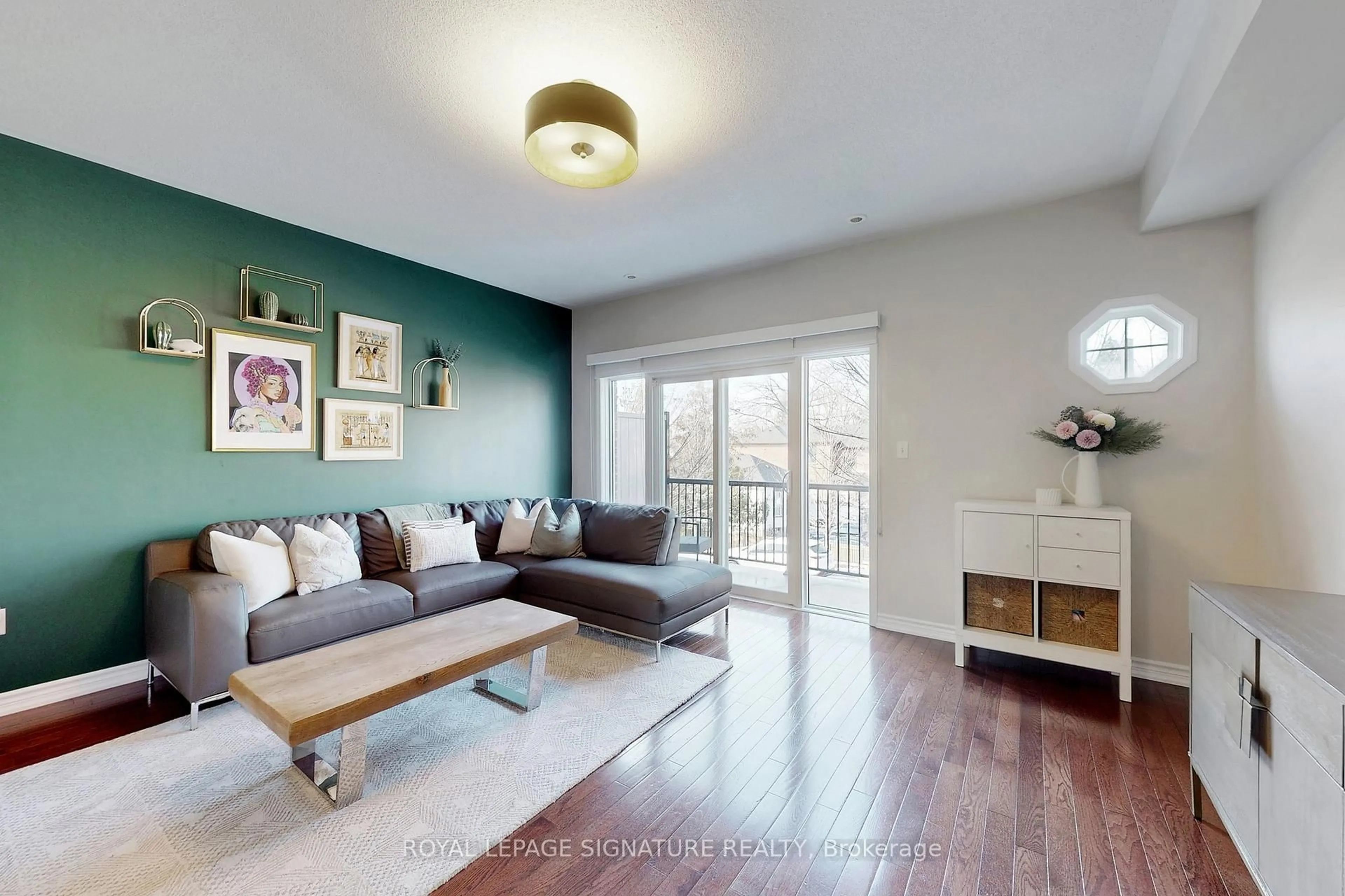 Living room with furniture, wood/laminate floor for 1115 Haig Blvd #4, Mississauga Ontario L5E 2M6