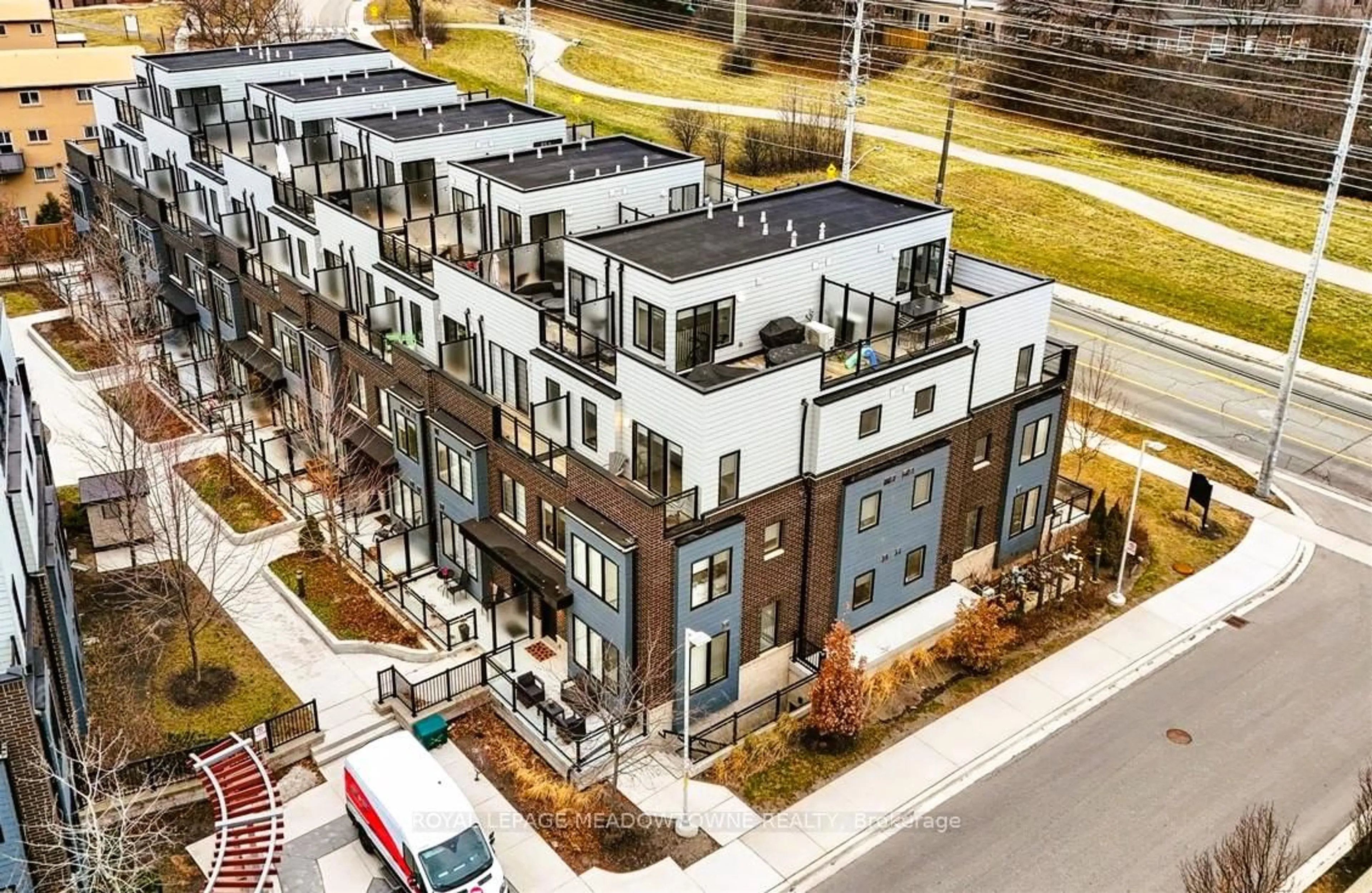 A pic from outside/outdoor area/front of a property/back of a property/a pic from drone, street for 2232 Bromsgrove Rd #TH #1, Mississauga Ontario L5J 0B3