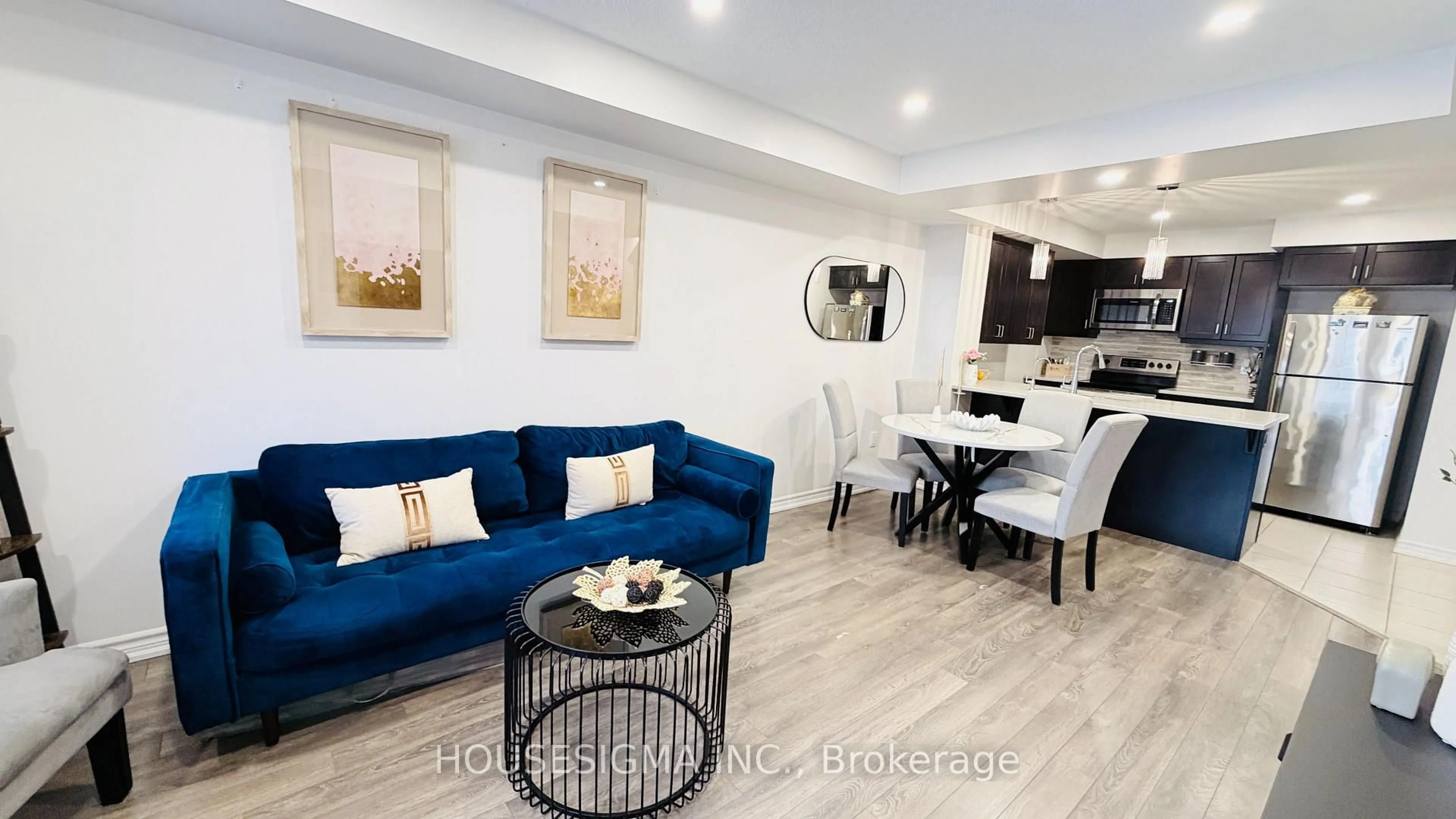 Living room with furniture, wood/laminate floor for 1222 Rose Way #50, Milton Ontario L9E 1P1