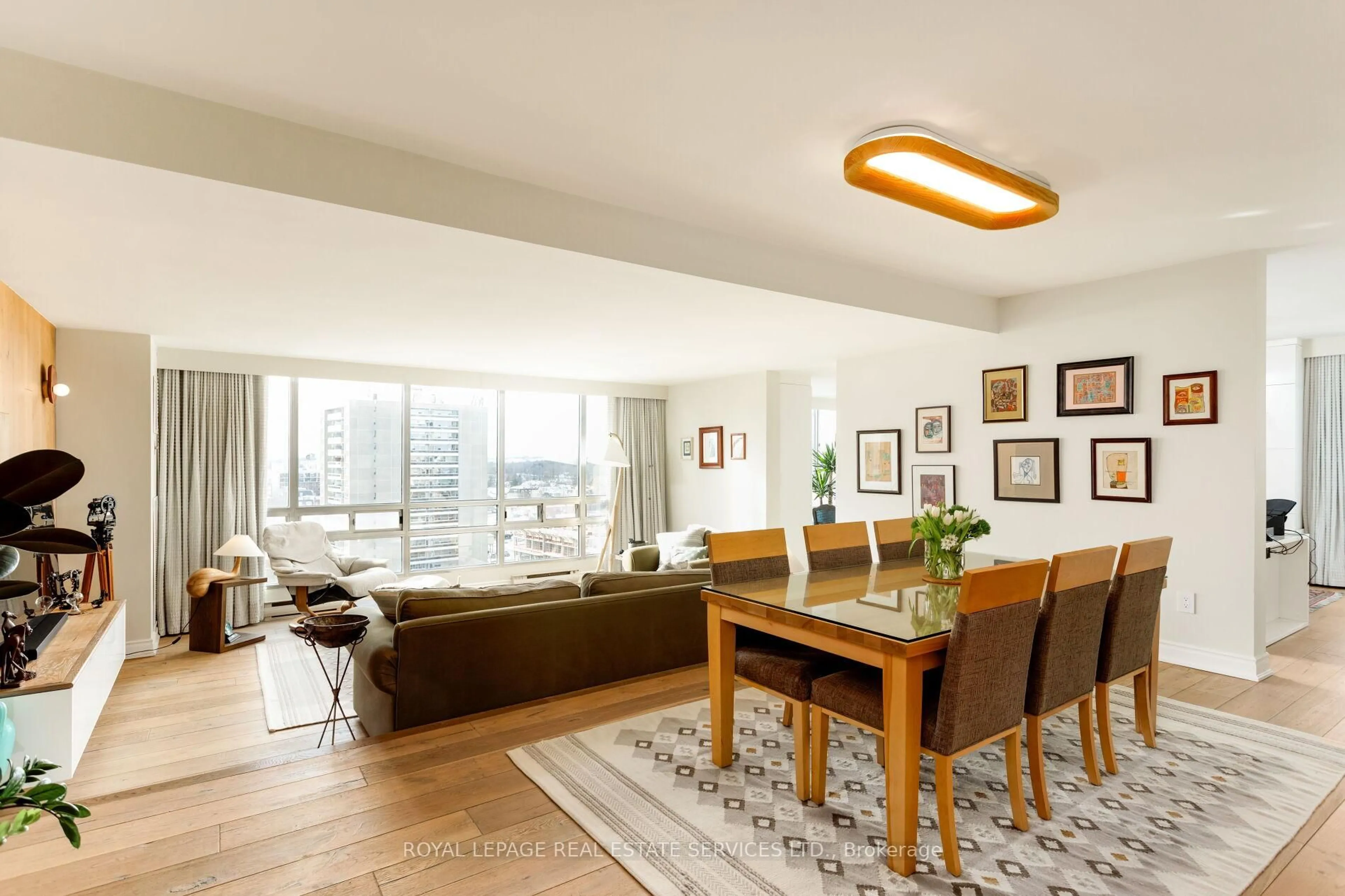 Living room with furniture, wood/laminate floor for 2180 Marine Dr #1401, Oakville Ontario L6L 5V2