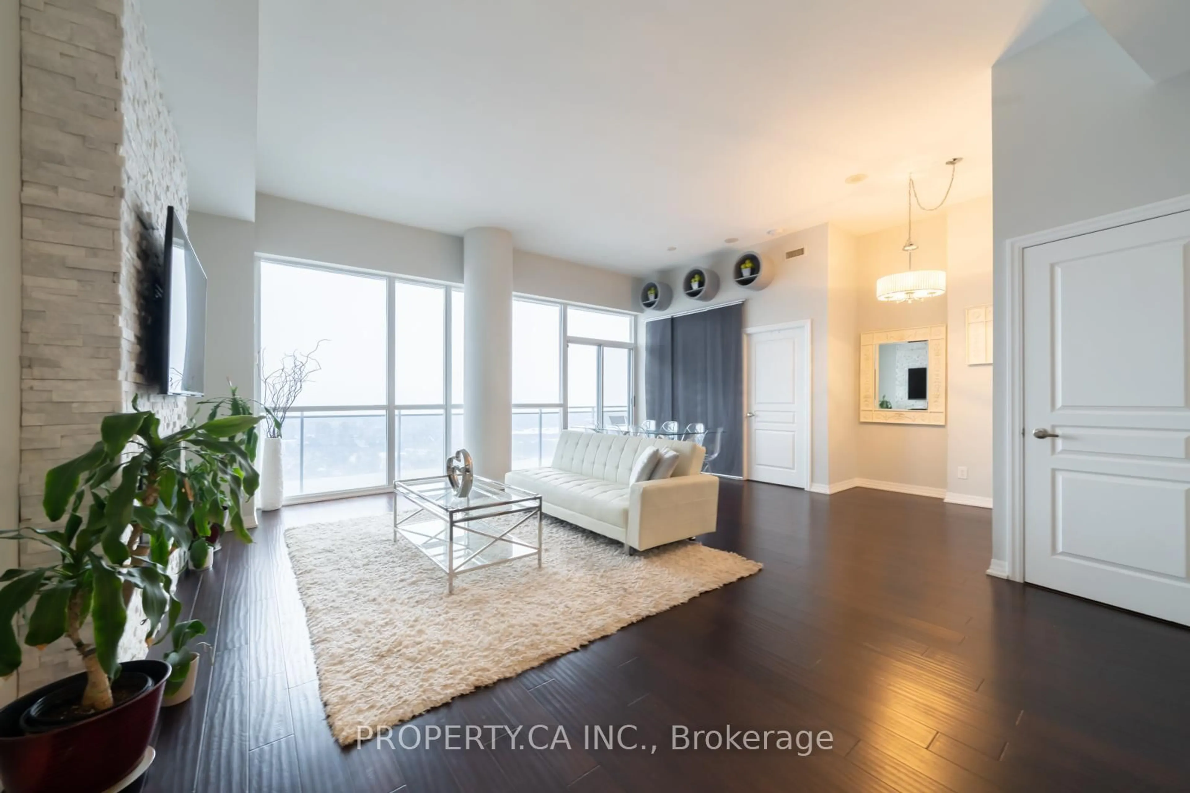 Living room with furniture, wood/laminate floor for 223 Webb Dr #PH3504, Mississauga Ontario L5B 0E8