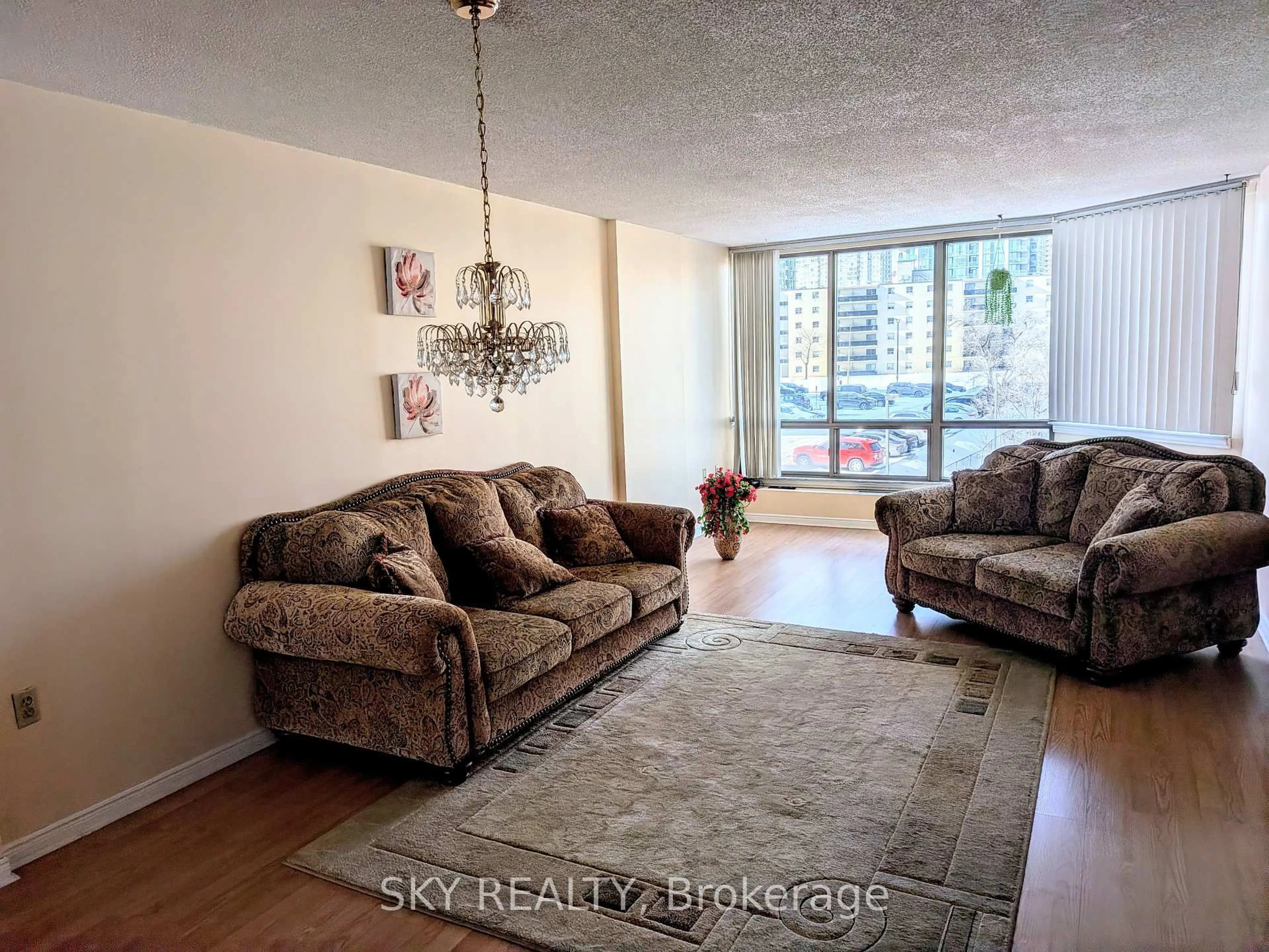 Living room with furniture, unknown for 25 Fairview Rd #405, Mississauga Ontario L5B 3Y8