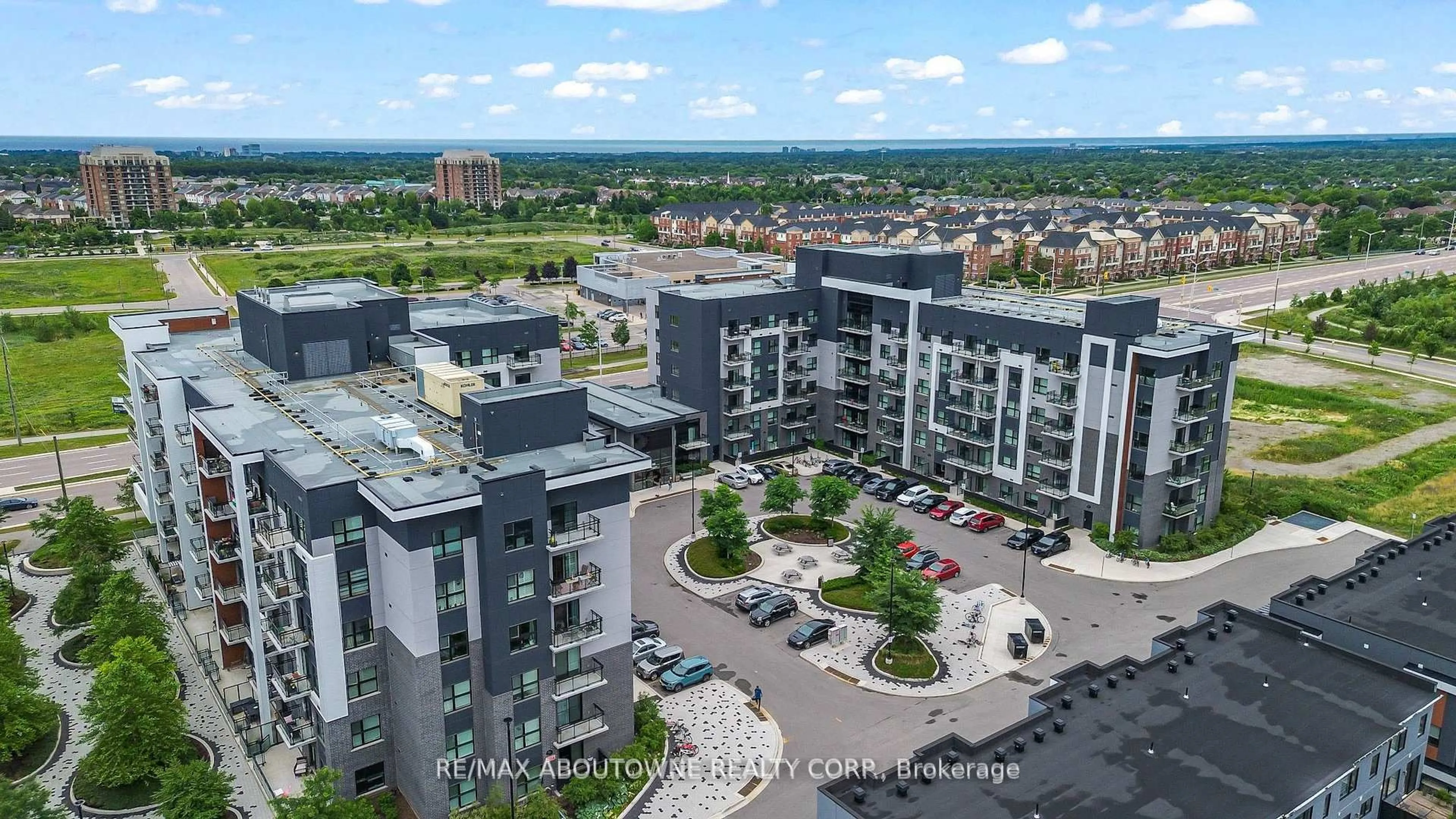 A pic from outside/outdoor area/front of a property/back of a property/a pic from drone, city buildings view from balcony for 102 Grovewood Common #121, Oakville Ontario L6H 0X2