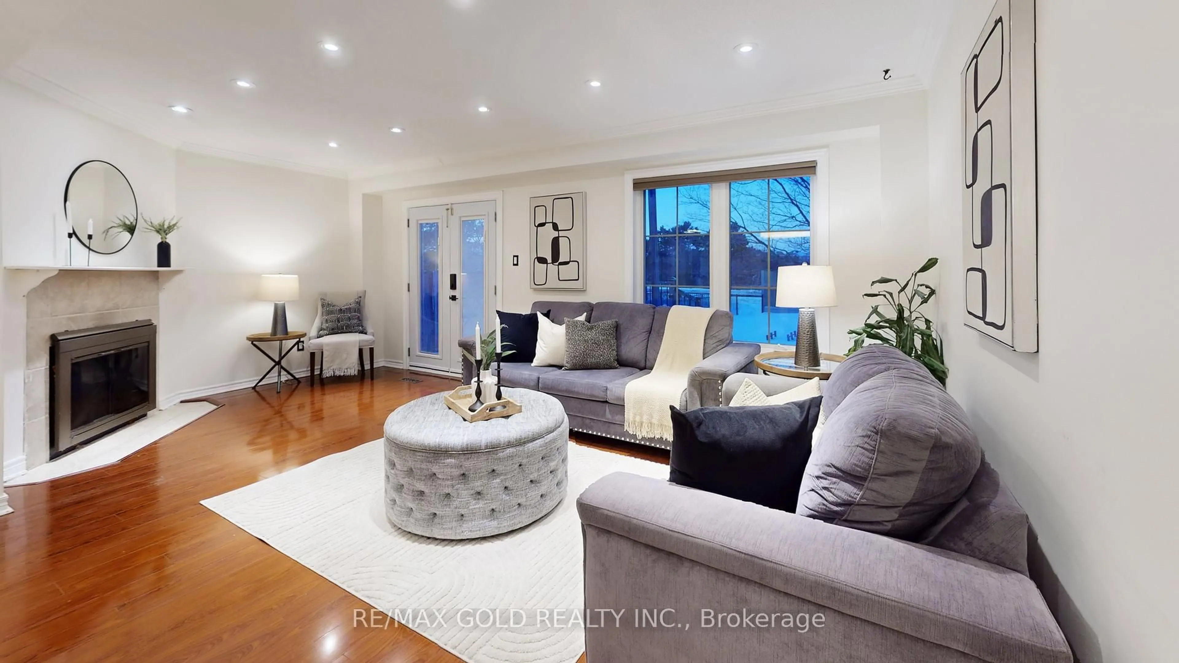 Living room with furniture, wood/laminate floor for 156 Royal Salisbury Way, Brampton Ontario L6V 3J9