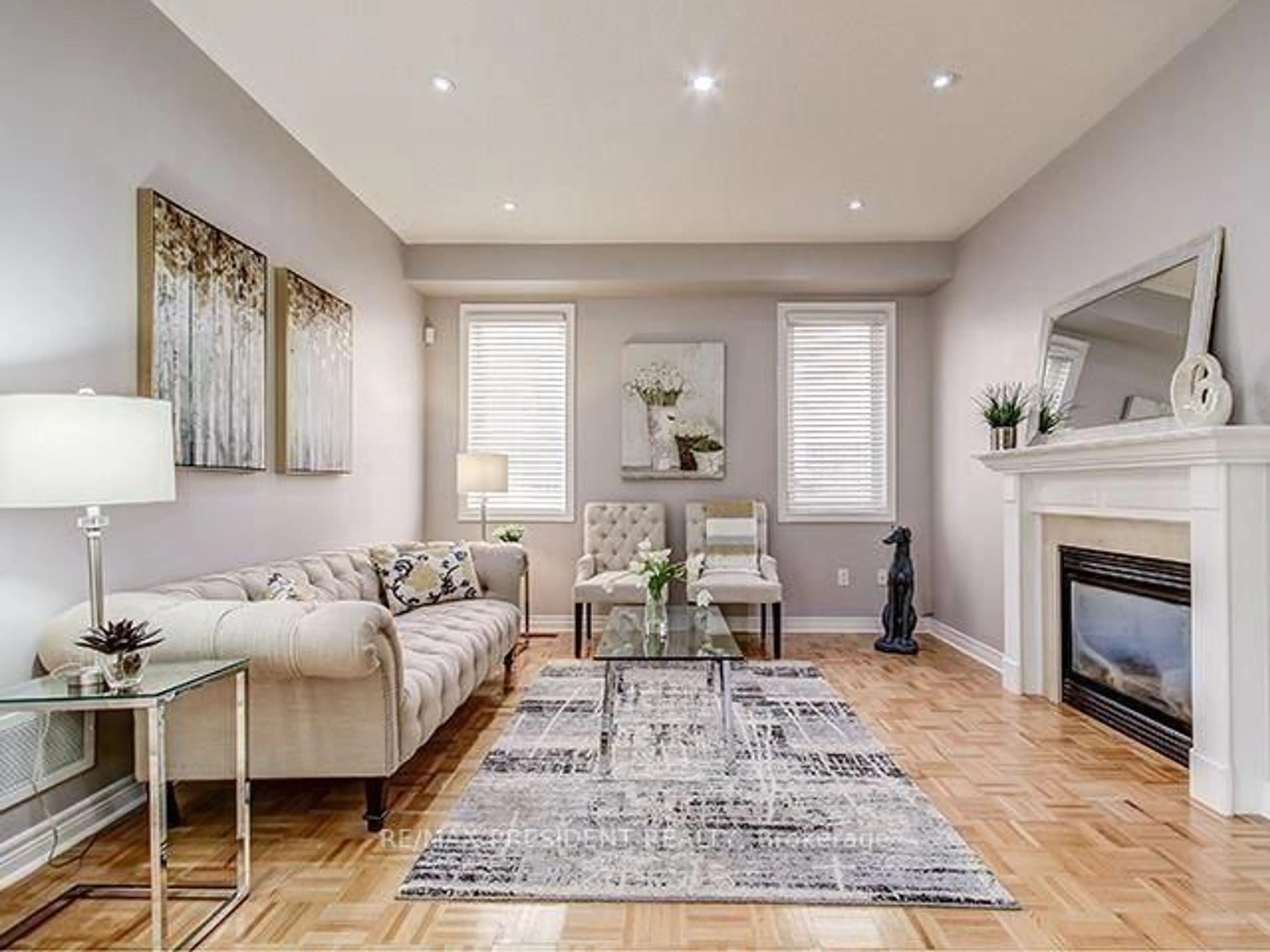 Living room with furniture, wood/laminate floor for 4 Cairnburg Dr, Brampton Ontario L6P 1X3