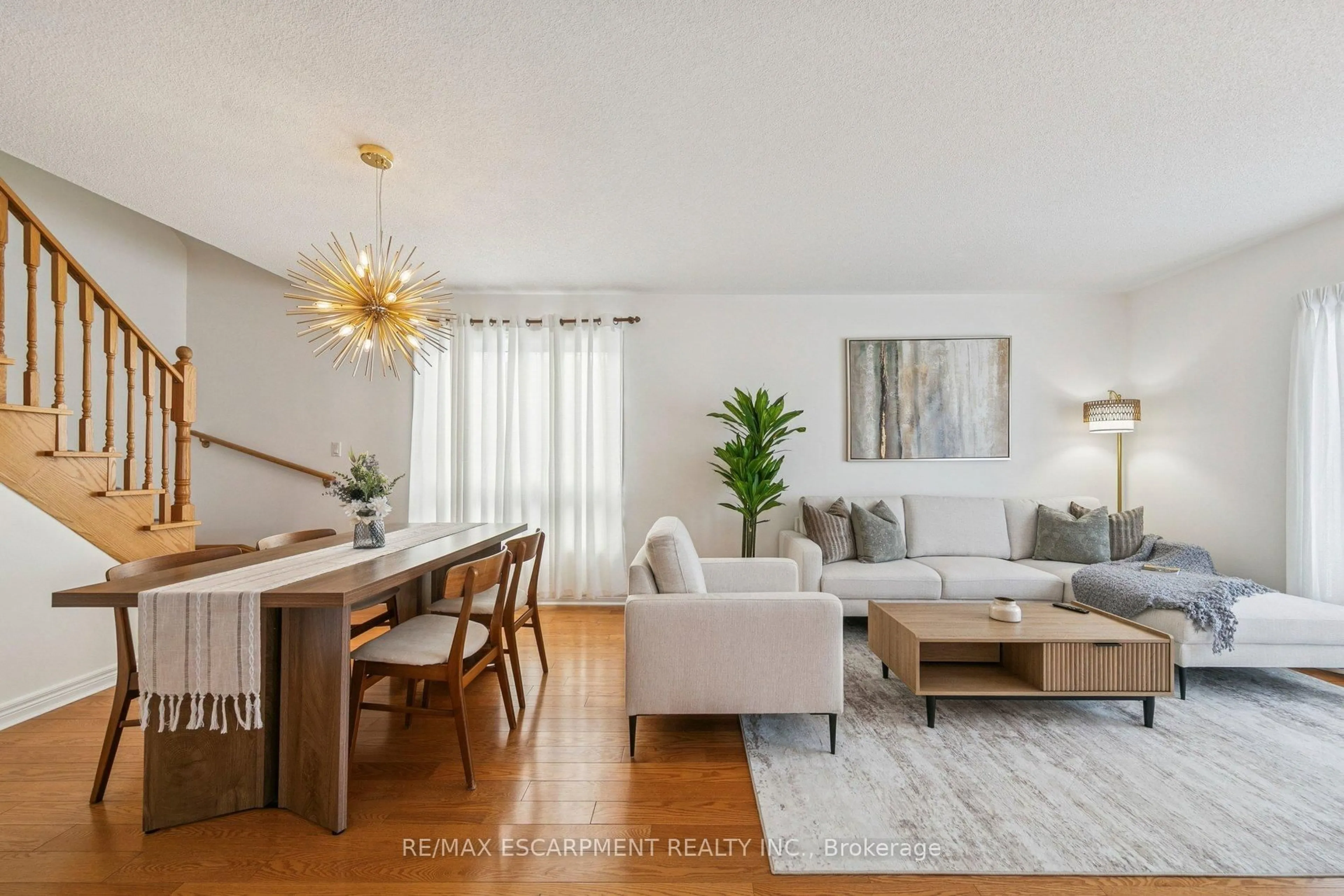 Living room with furniture, wood/laminate floor for 245 Centennial Forest Dr, Milton Ontario L9T 5W9