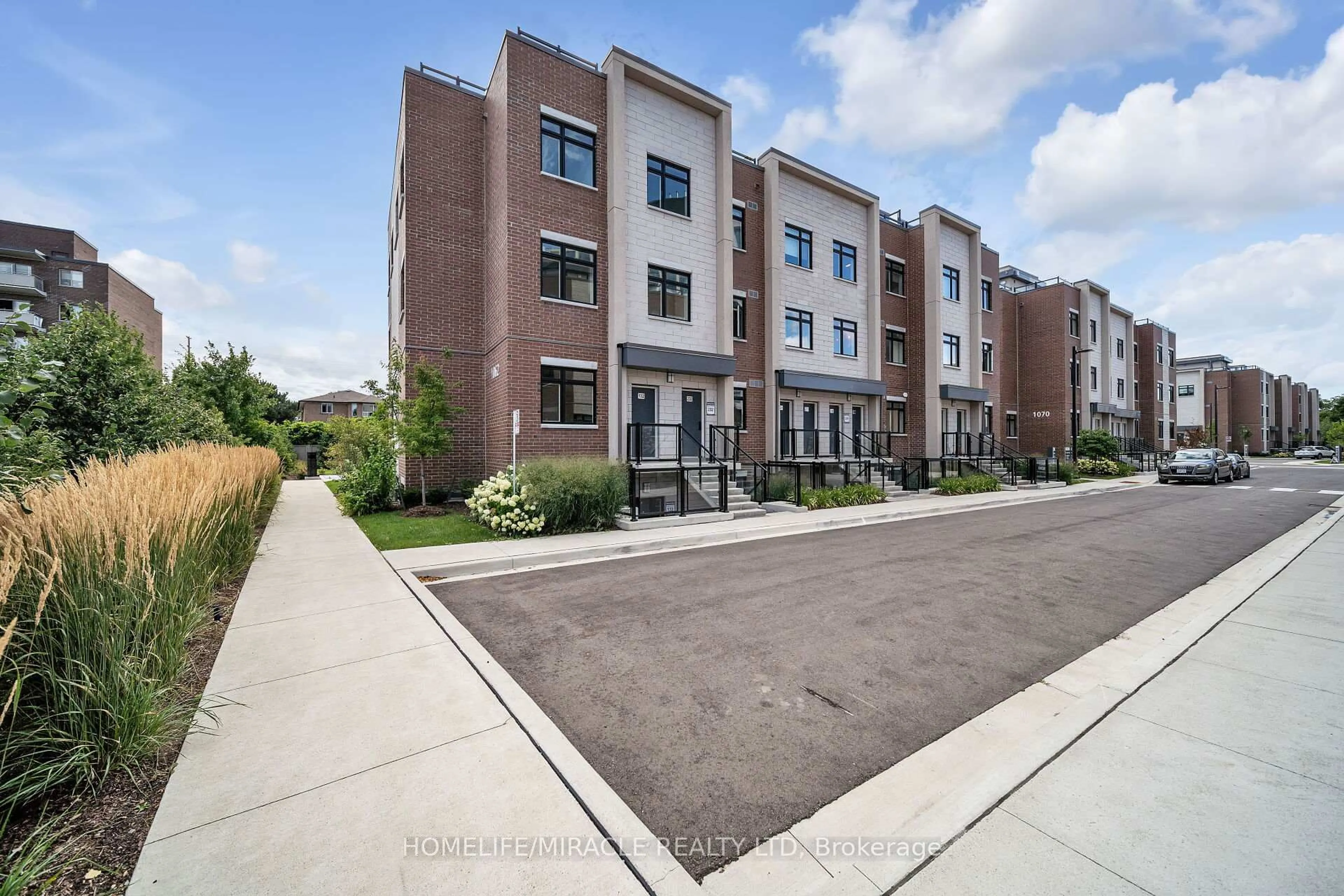 Home with brick exterior material, street for 1062 Douglas McCurdy Common #230, Mississauga Ontario L5G 4B1